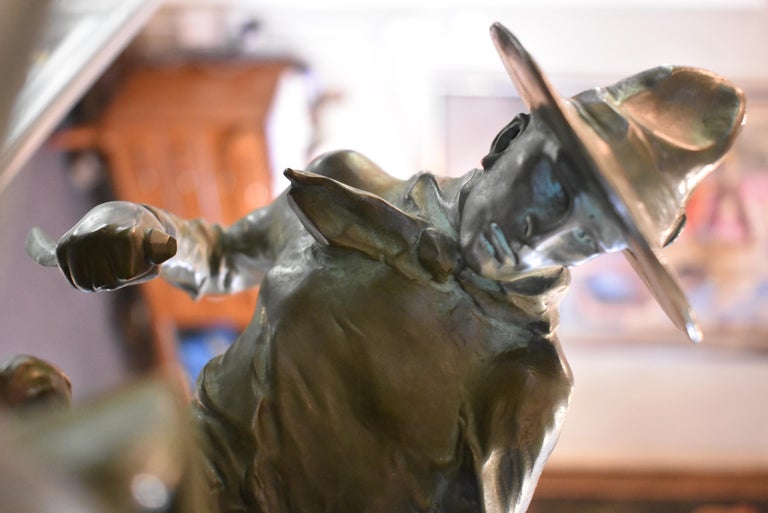 Bruno Zach signed bronze sculpture of two fighting cowboys with daggers on rearing horses.
