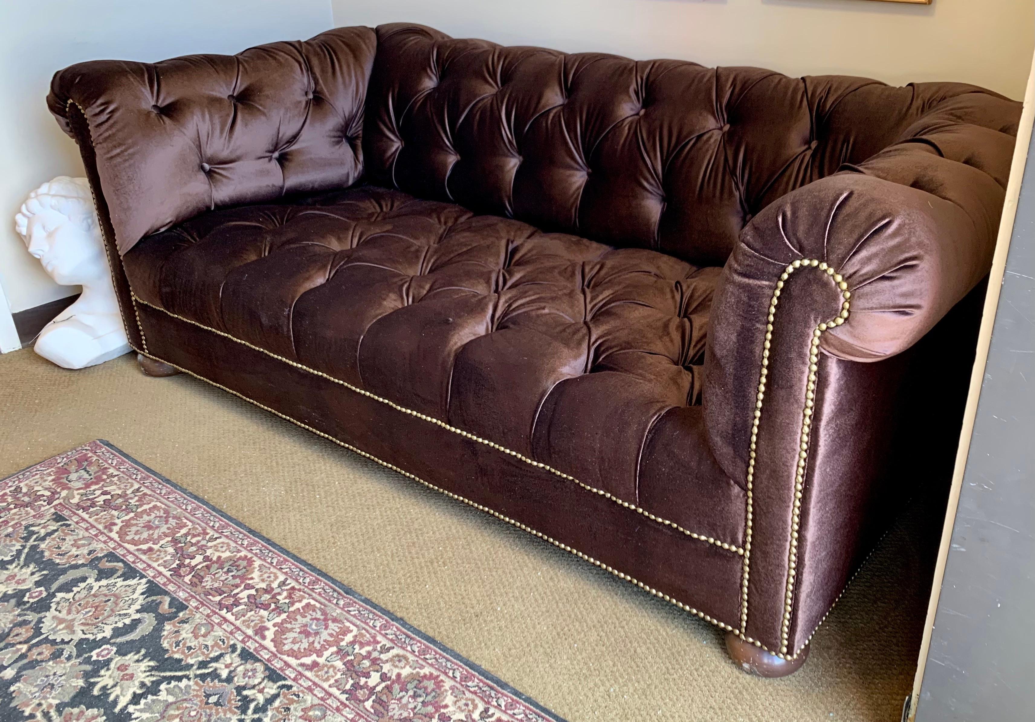 Newly upholstered seven foot Chesterfield sofa by Brunschwig & Fils done in a luxurious chocolate
brown velvet (not Brunschwig fabric), gorgeous lines and better scale. The sofa is adorned with nailheads
at border which make brown velvet look that