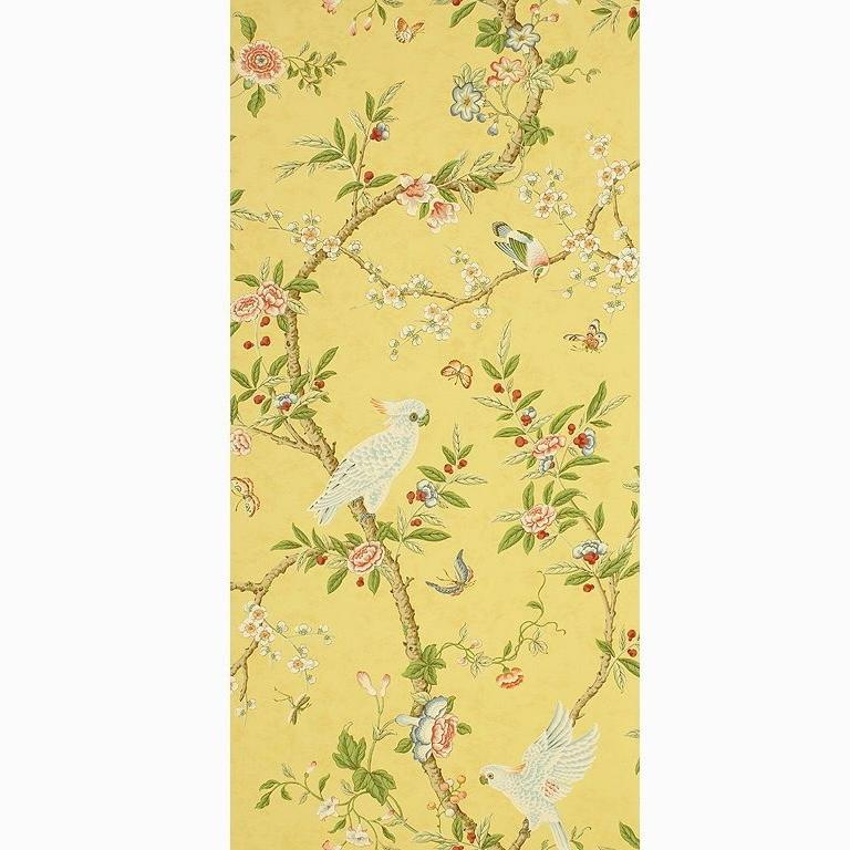 Brunschwig & Fils hand-printed yellow Kanchou wallpaper, floral, avian, parrots.  2002. Design features lovely yellow background and a large floral and avian pattern, which includes white parrots, berries, and pink blossoms in various states of