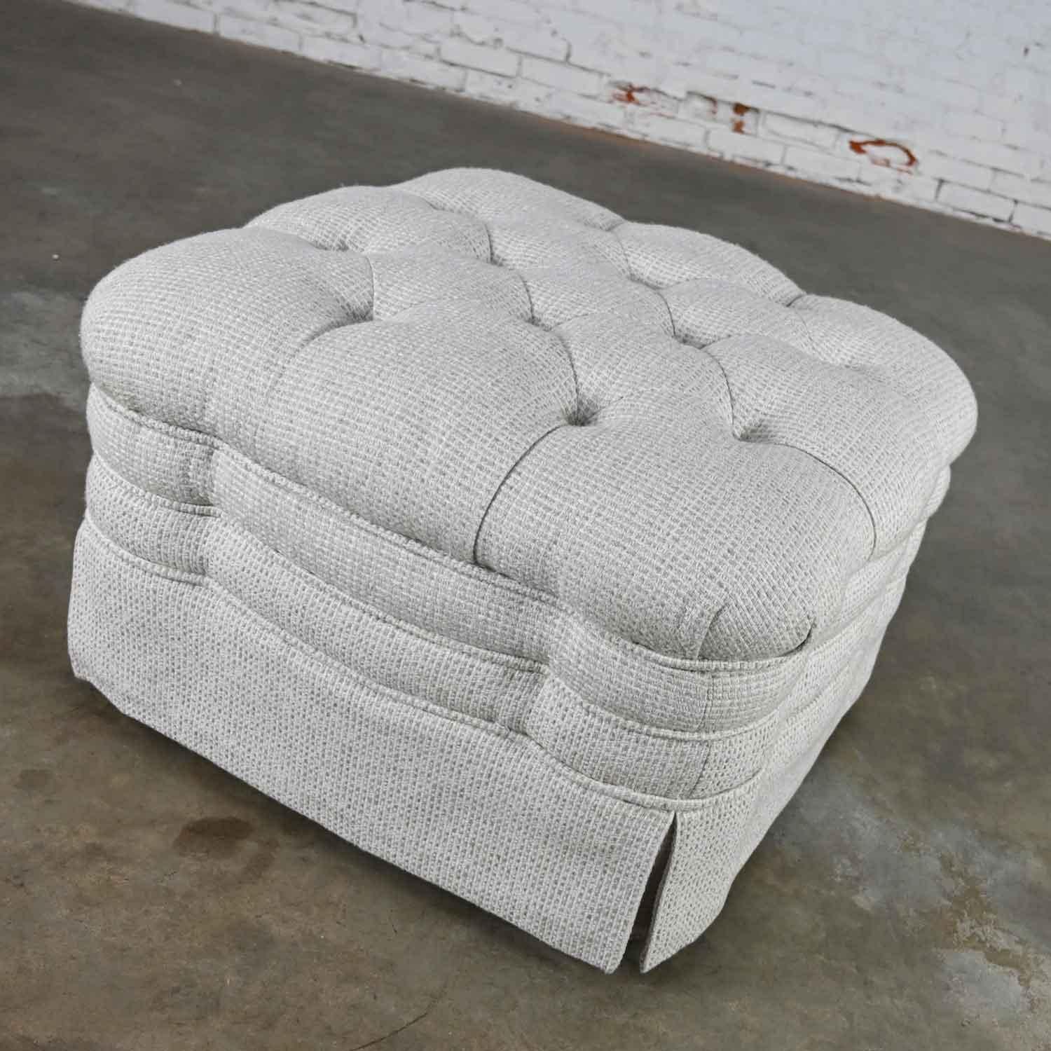 Wonderful vintage Brunschwig & Fils St. Andrews tufted ottoman on four hooded ball casters with Robert Allen Avanzata fabric in glacier colorway. Beautiful condition, keeping in mind that this is vintage and not new so will have signs of use and