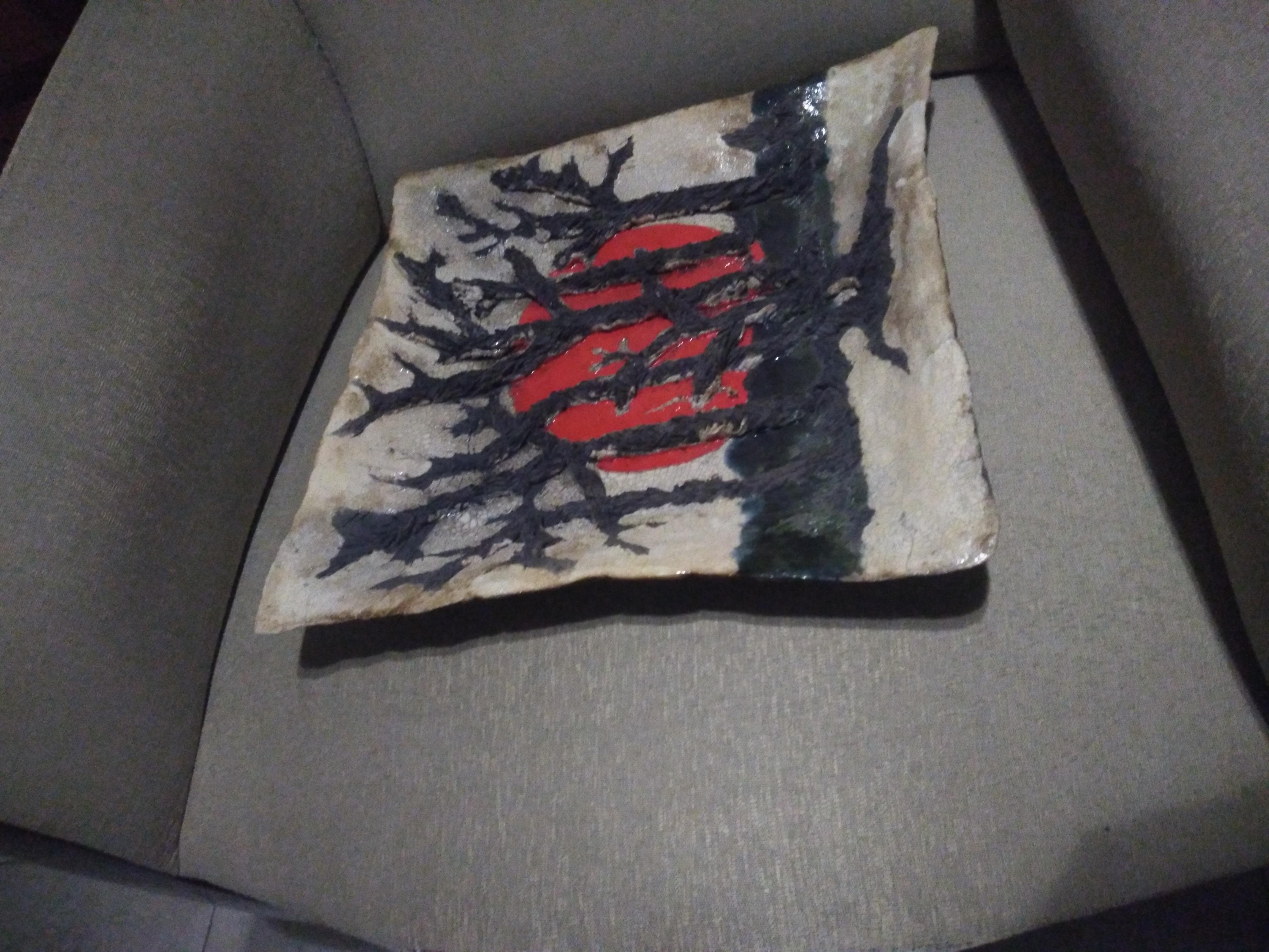 This is a stunning plate by Bruny Graves! It has a lot of texture and contrasting color! The trees are outcised and highly textured. The plate has a nice crackled glaze. 

A beautiful plate/ bowl.