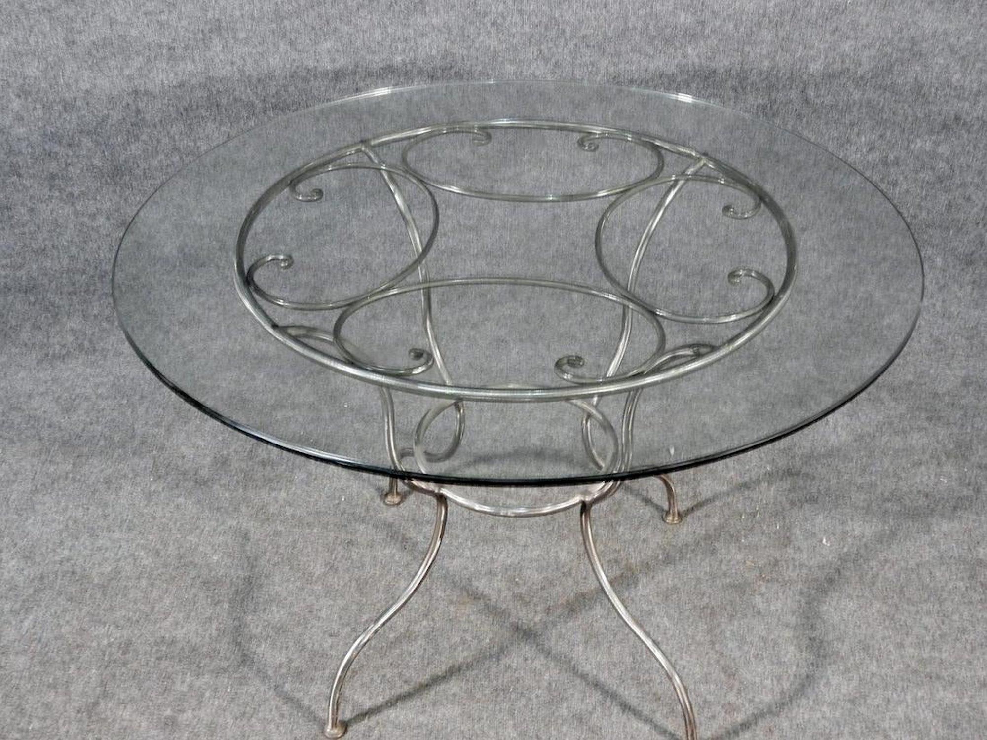 Metal base with brush metal finish and round glass top.
(Please confirm item location - NY or NJ - with dealer).
   