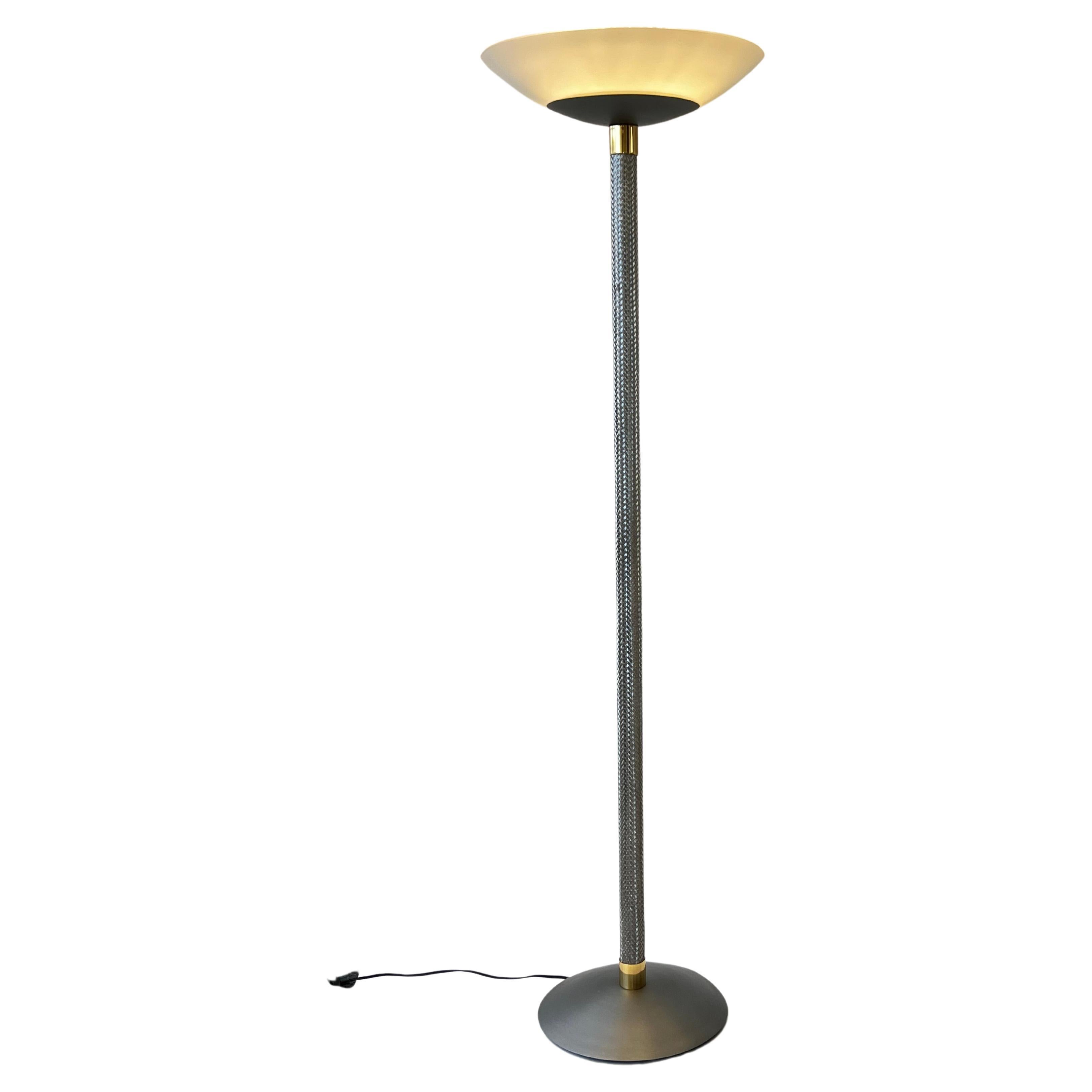 Fabulous 1980’s torchiere floor lamp by Robert Sonneman for Kovacs. 
Retains Kovacs label. 
Constructed of woven and brushed stainless steel with brass detail. The shade is white frosted glass. 
In original vintage condition shows minor wear
