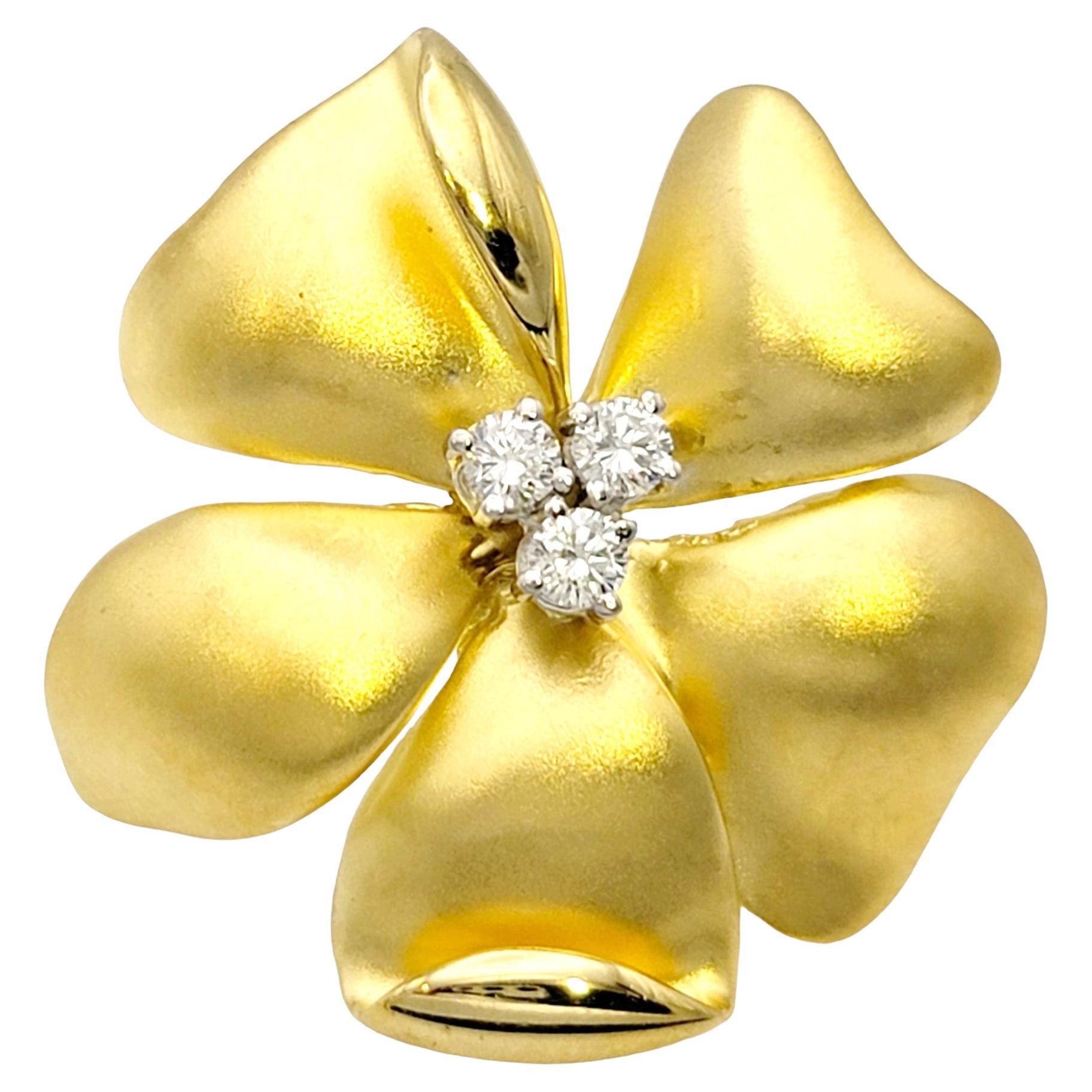 Brushed 18 Karat Yellow Gold Flower Pin / Brooch with Round Diamond Accents For Sale