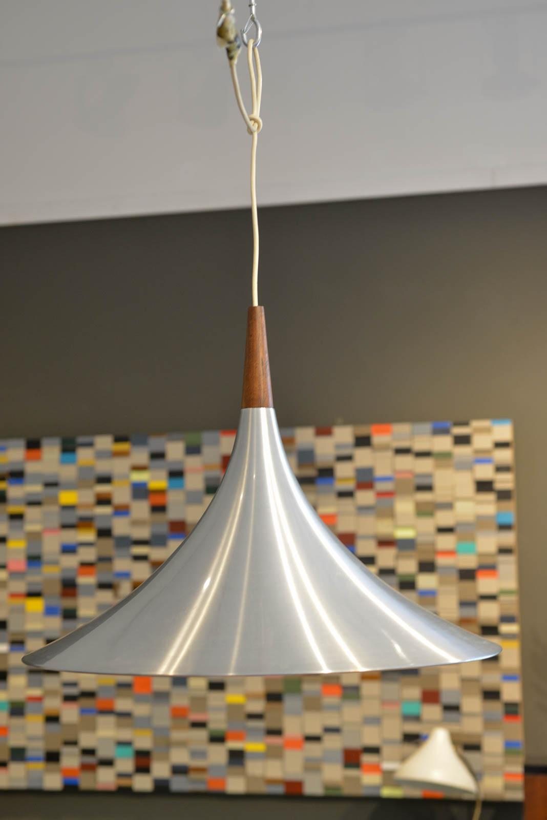 Brushed aluminum and rosewood Fluted pendant light, ca. 1970 in the style of Thorup and Bonderup for Fog & Morup. Custom made by a prominent lighting designer in Southern California for his own home, this beautiful large pendant is brushed aluminum