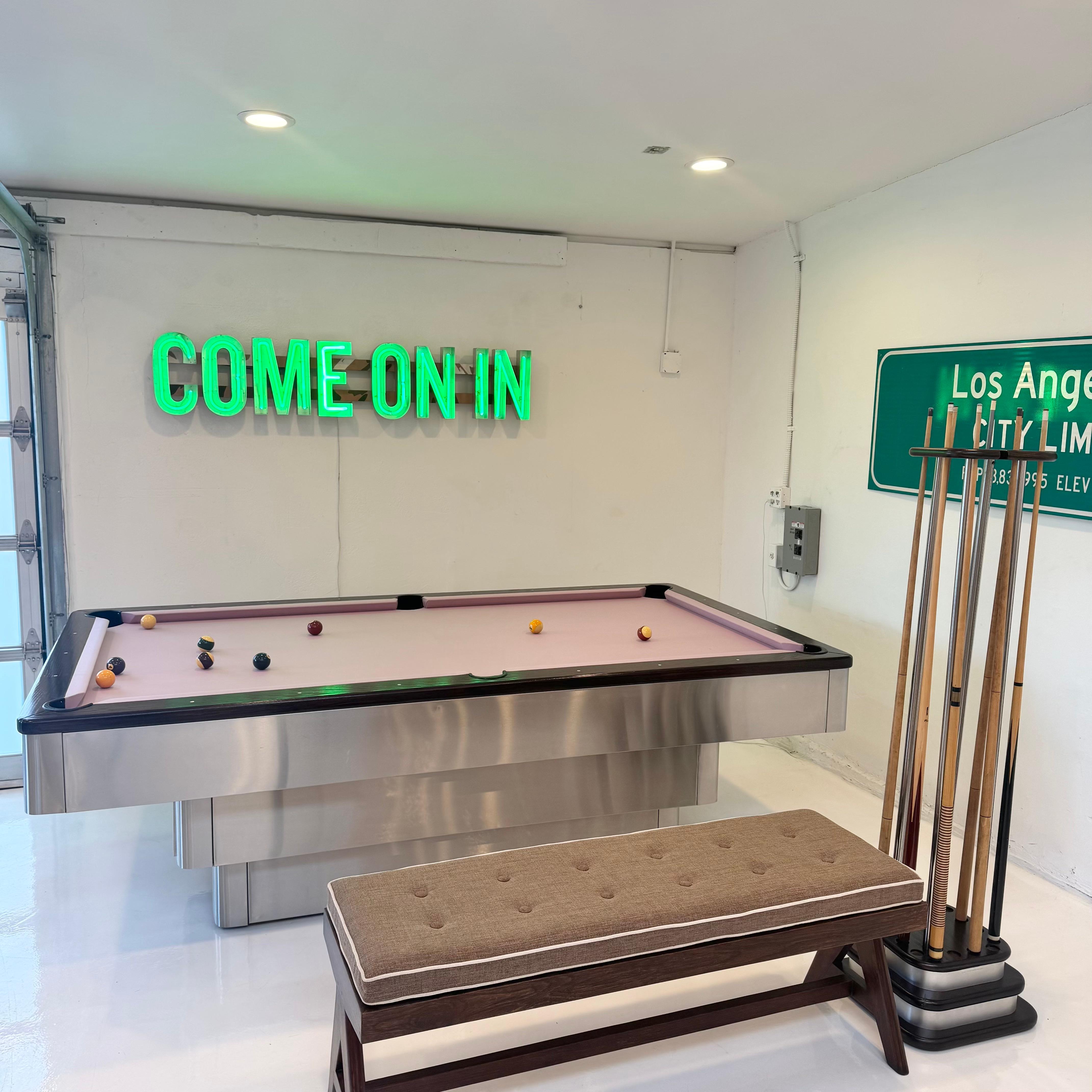 Custom made regulation size, three tiered pool table from the 1980s. Made in the USA.

Hidden ball return system allows each pocketed ball to roll internally back to the front of the pool table. Hidden panel opens a compartment on the middle level