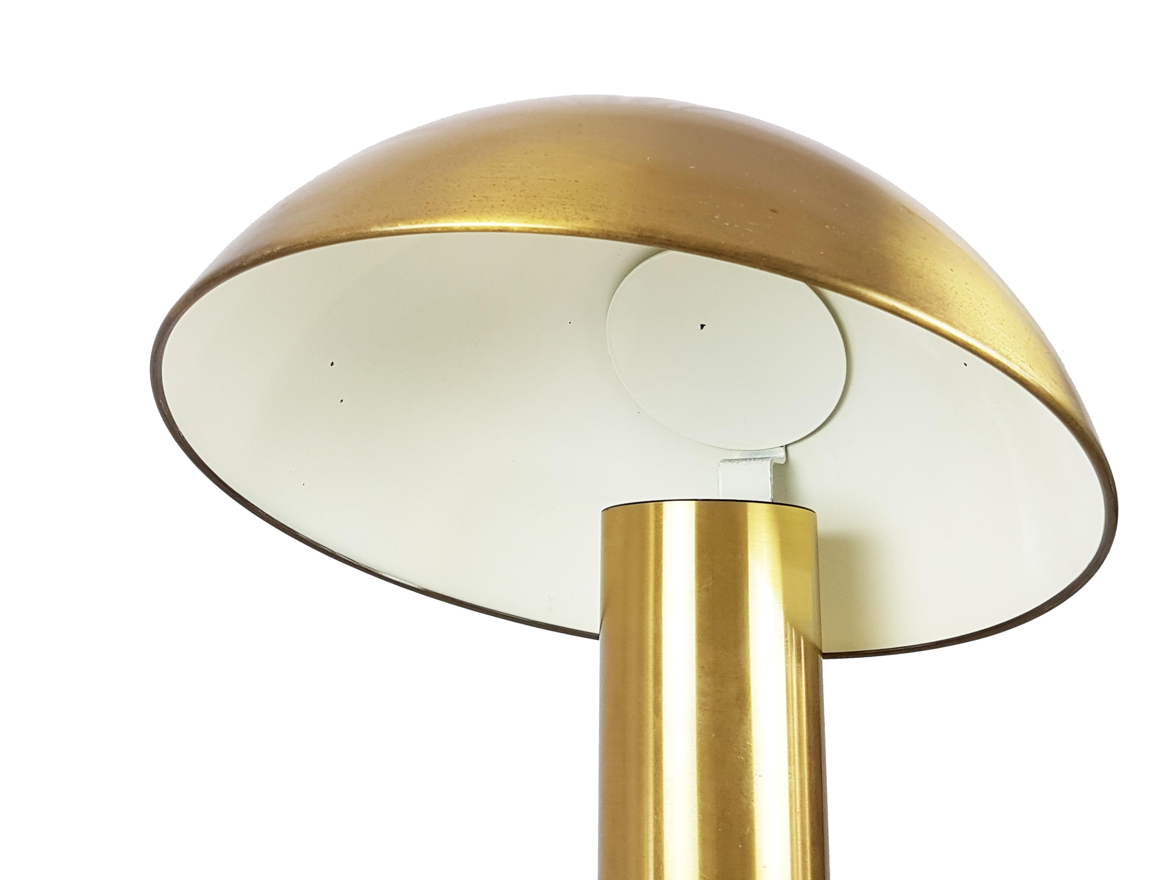 This table lamp was designed by Franco Mirenzi for Valenti in 1978. It is made from mat brass and metal and it features a dimmable electrical system. Fair vintage condition: Signs of wear and oxidation patina consistent with age and use. See