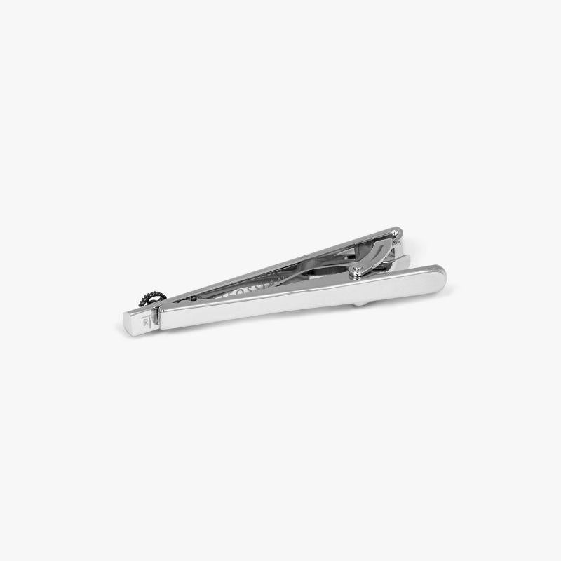 Brushed Gear Tie Clip with Rhodium Finish

A single spinning gear, carefully mounted on the end of our highly-polished tie clip creates a fun sense of movement to add to your look. The gear is set in black rhodium, offset by brushed, white rhodium