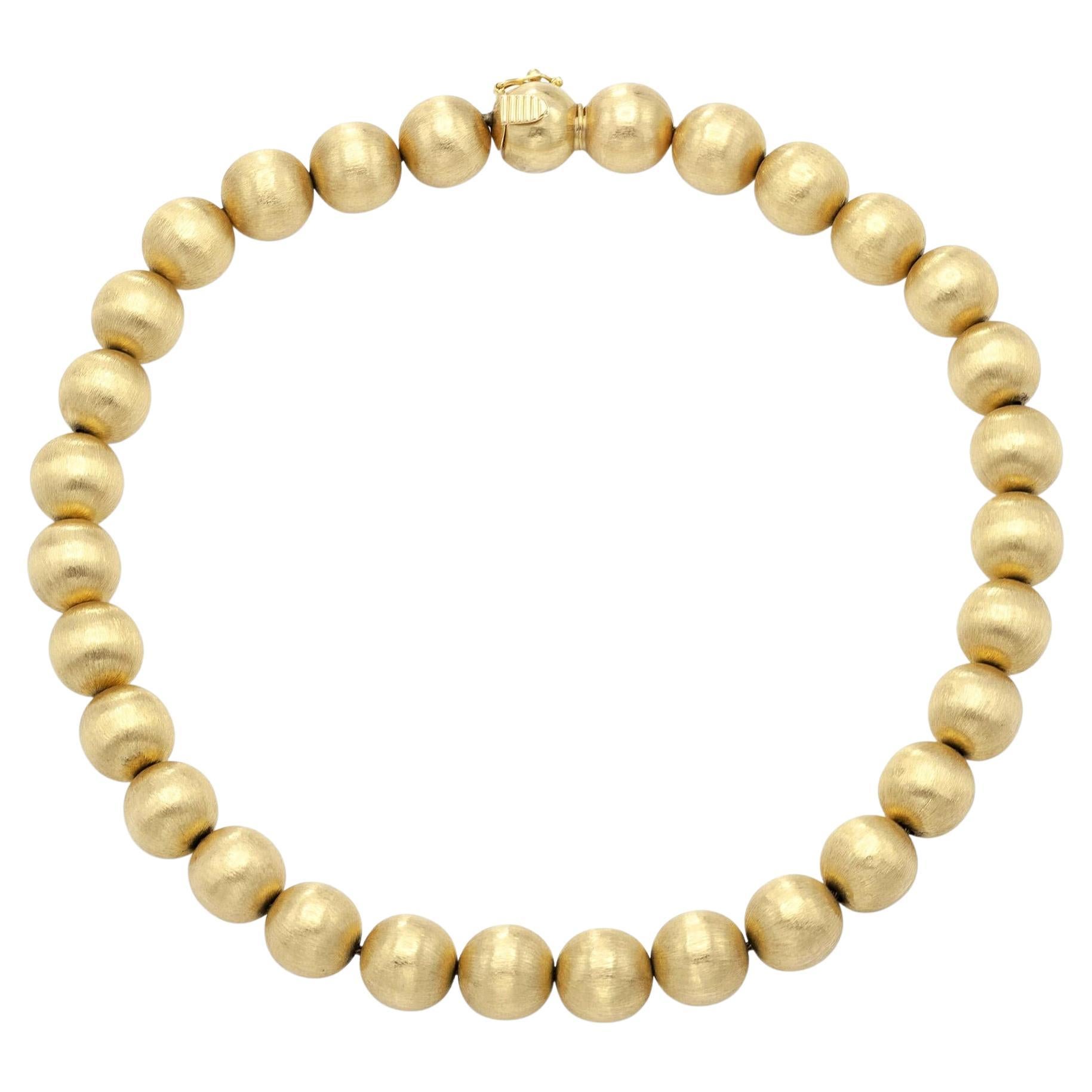 Collana di palline in oro spazzolato