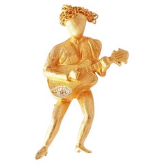 Brushed Gold Guitar Player Figural Brooch By R. Mandle, 1960s