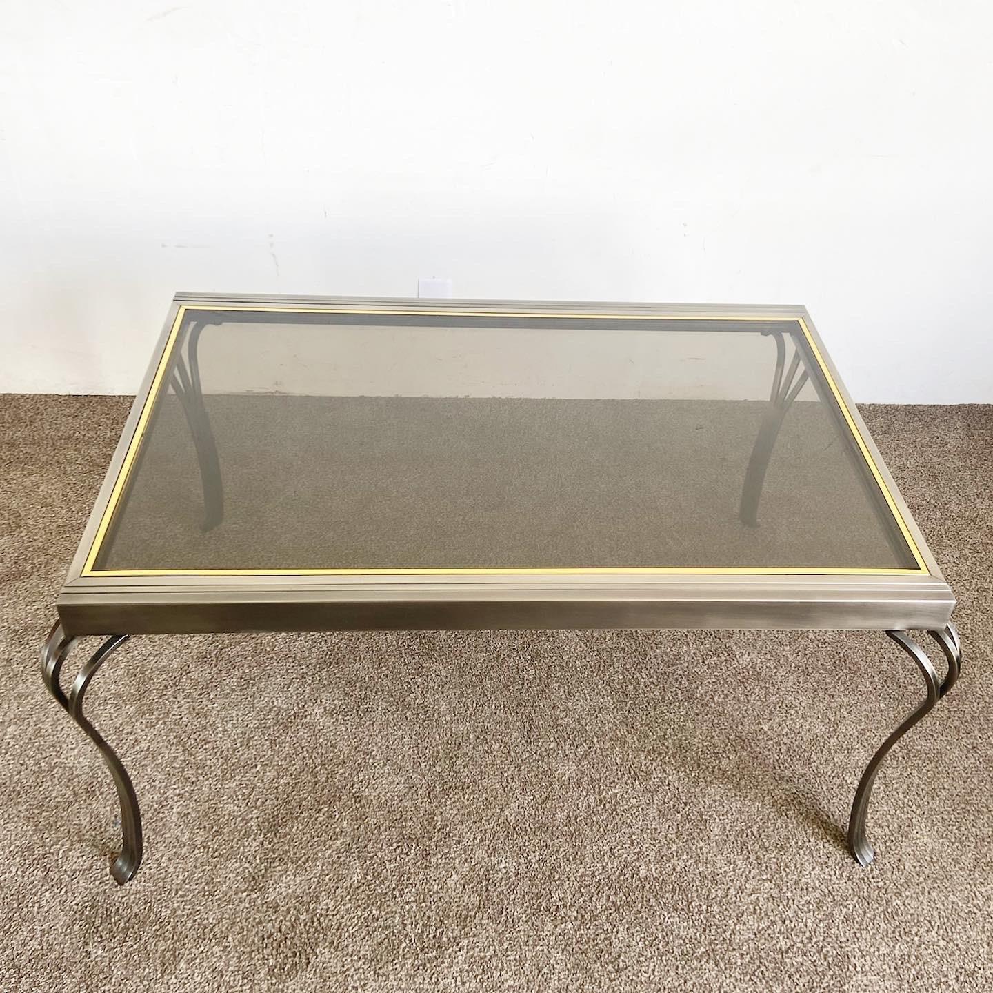 Experience a blend of modern elegance and functional design with our Brushed Metal Smoke Glass Top Extendable Dining Table by Design Institute America, a perfect addition to any contemporary dining space.

Elegant, extendable dining table by Design
