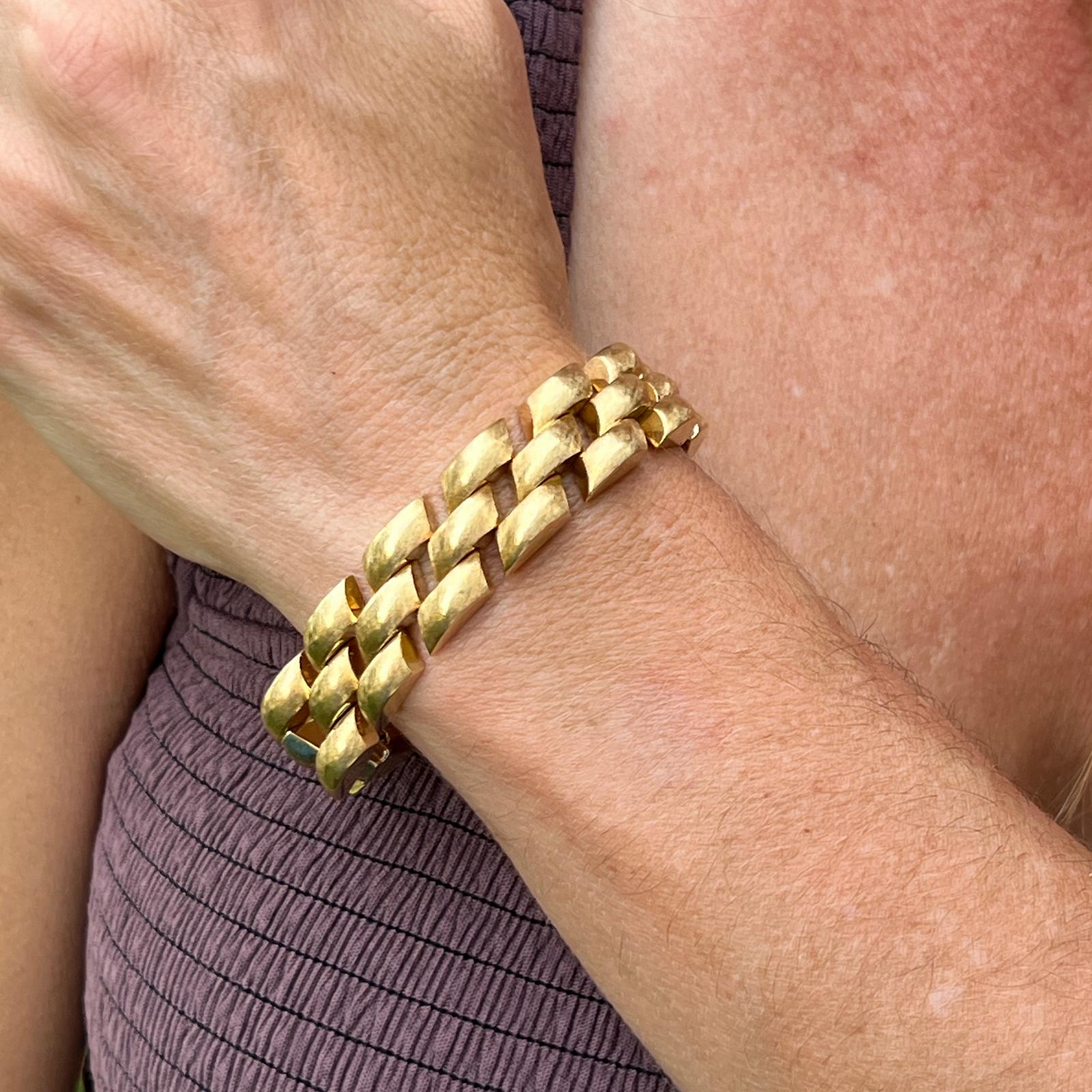 Beautiful brushed satin finish slanted link bracelet from the late twentieth century. The bracelet, crafted in 14 karat yellow gold,  measures 6.50 inches in length and .60 inches in width. Will fit a smaller wrist. 