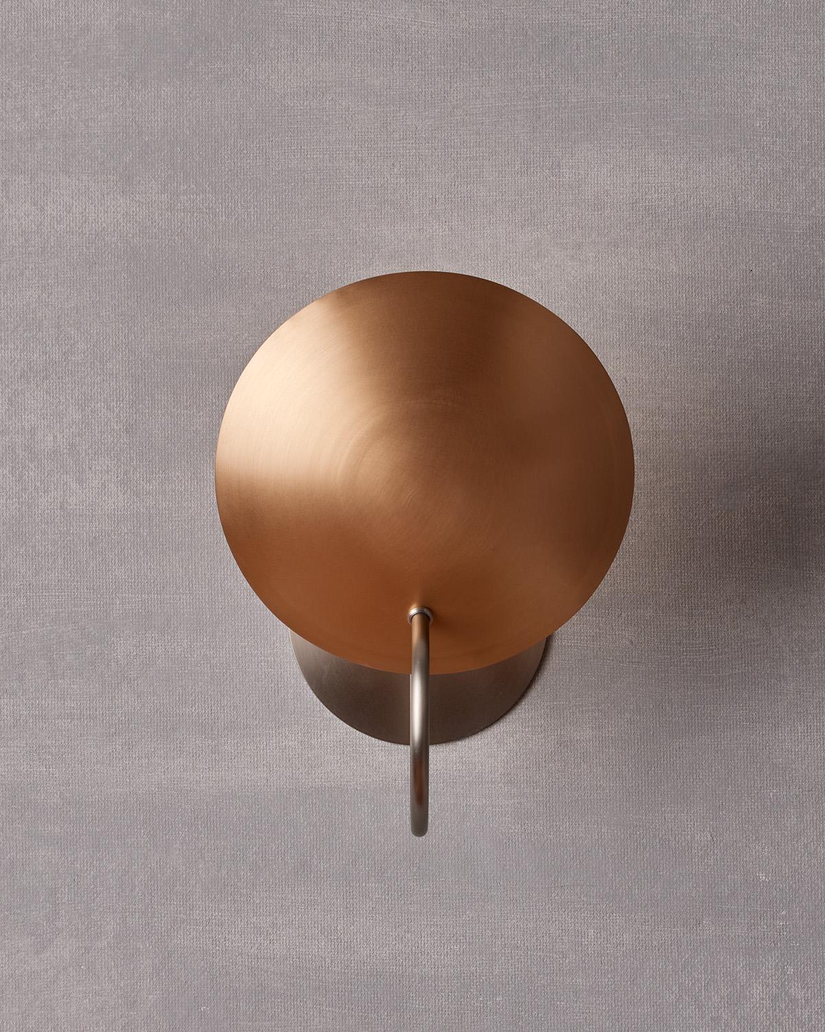 The Arlo Sconce features a spun bronze reflector affixed to a curved brass arm, complimenting any space with warmth and subtlety.

OVERALL DIMENSIONS
9