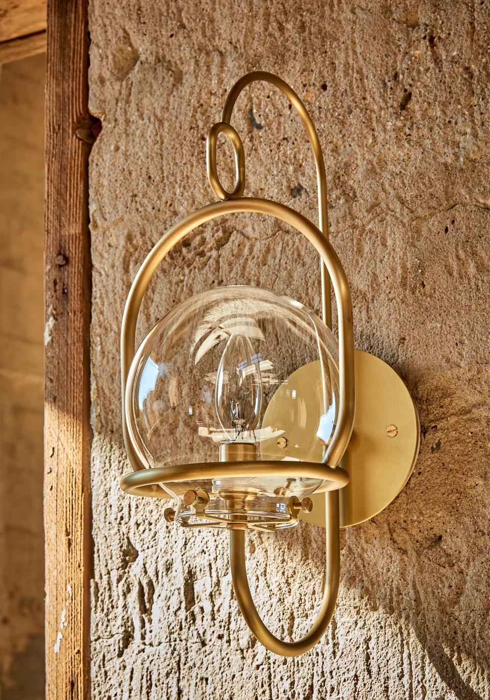 The scaled-down version of our Emil Wall Lantern provides versatility both indoors and out. Clean bent brass lines update this classic lantern with a nod to tradition.

OVERALL DIMENSIONS
7.25