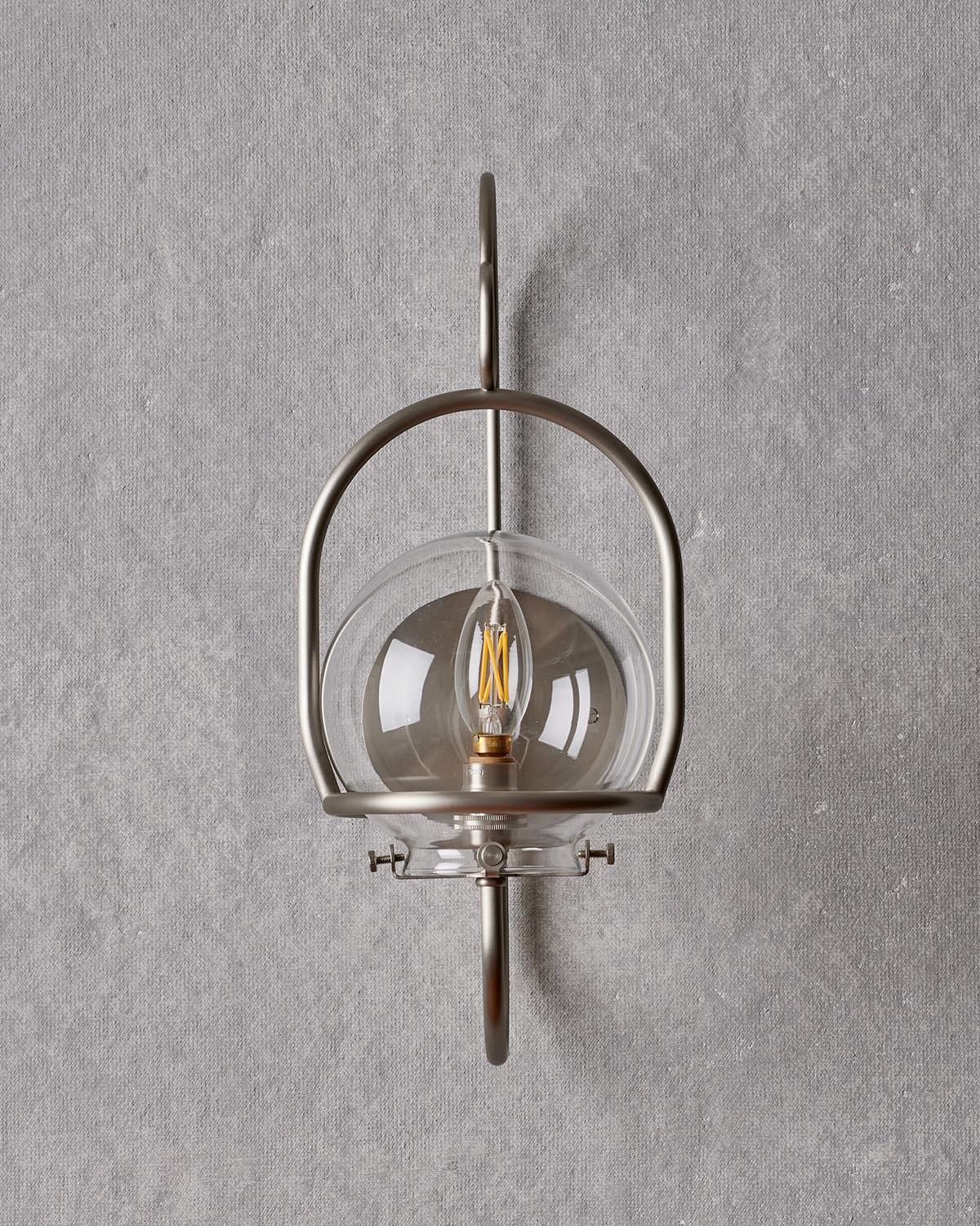 The scaled-down version of our Emil Wall Lantern provides versatility both indoors and out. Clean bent brass lines update this classic lantern with a nod to tradition.

OVERALL DIMENSIONS
7.25