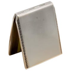 Brushed silver cigarette case with side strips and gold interior