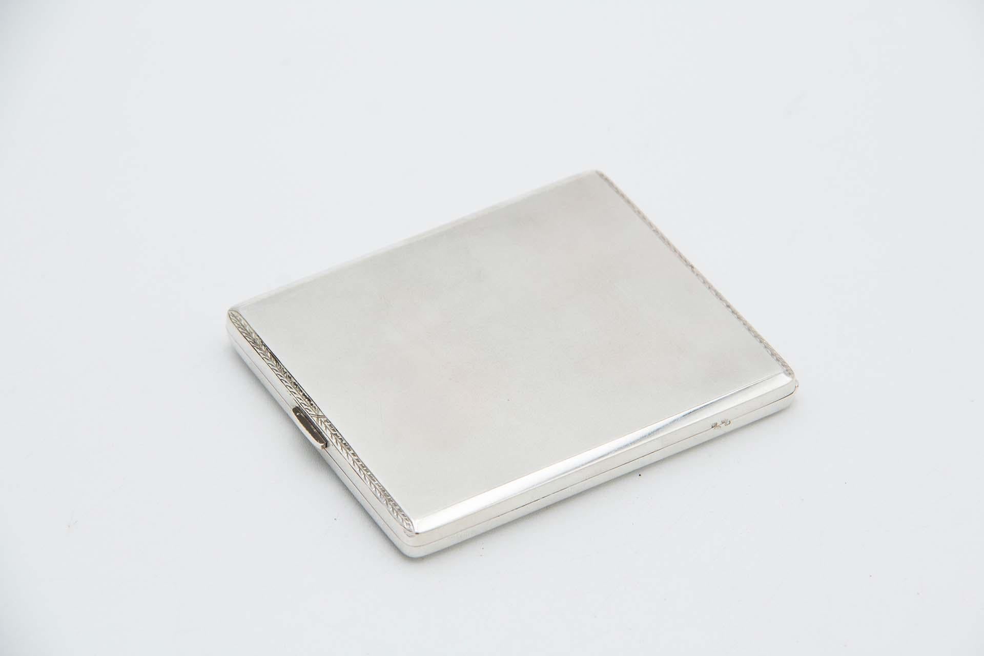 Description: Brushed silver cigarette case with surrounding grooves and hinged lid. Metal: Silver. Origin: Portuguese. Brand: javali II Title. Weight: 119.96 grams. Dimensions: 10cmx1cm. Content: 833/1000. Assay Mark: Yes, between 1887 and 1937.