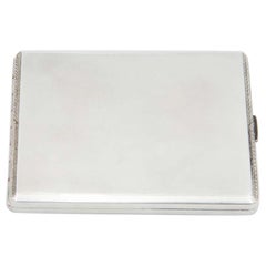 Brushed silver cigarette case with surrounding strips