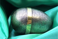 Brushed silver egg with a clown and circus dog inside, Fabergé style