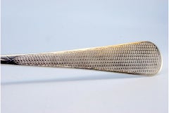 Brushed silver rice and serving spoon with monogrammed plaque on the handle