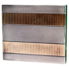 Brushed silver toiletry box with gold bands and powder-puff mirror