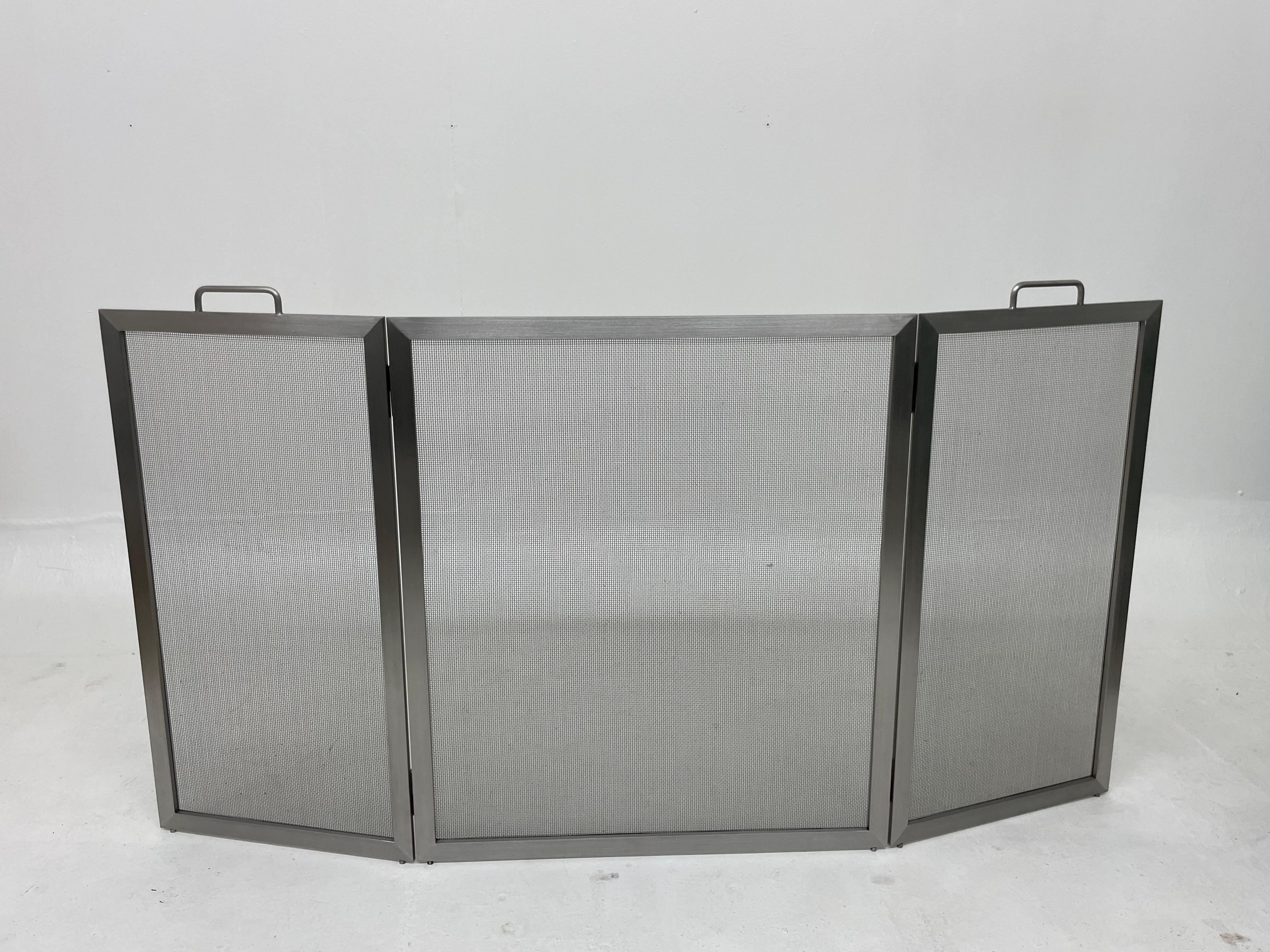 Hand fabricated stainless steel tri-fold fireplace screen with our standard #8 wire mesh backing and a brushed stainless finish. Dimensions are adjustable. Just let us know the space you are trying to fit and we will work from there. We look forward