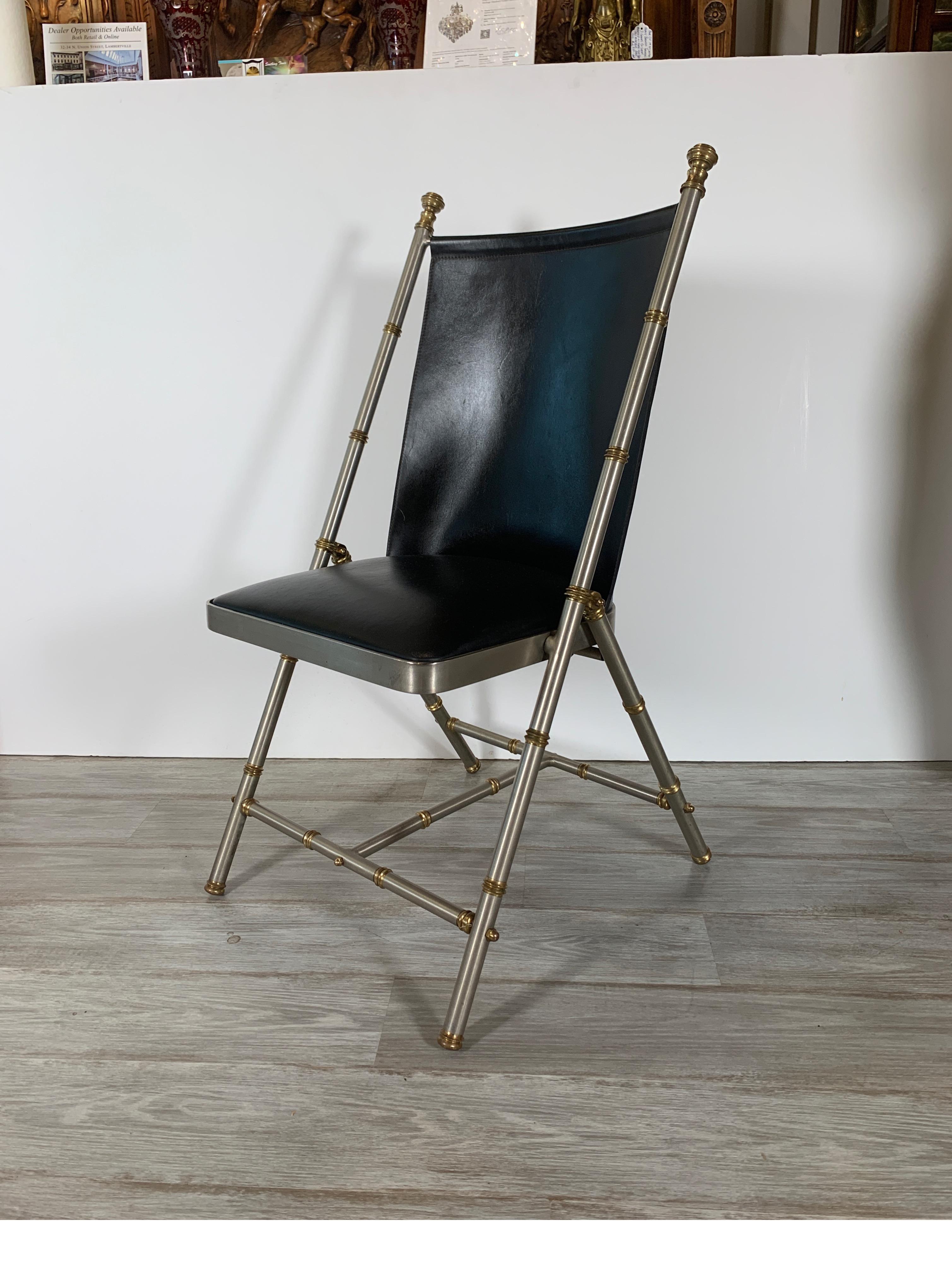 The faux bamboo motif frame with sturdy leather seat and back. Great early Campaign style with modern vibe. Great quality.