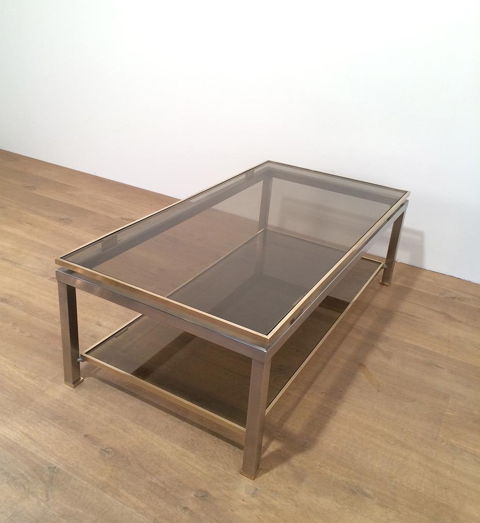 Laiton Table basse en acier brossé et laiton par Guy Lefèvre pour Maison Jansen en vente