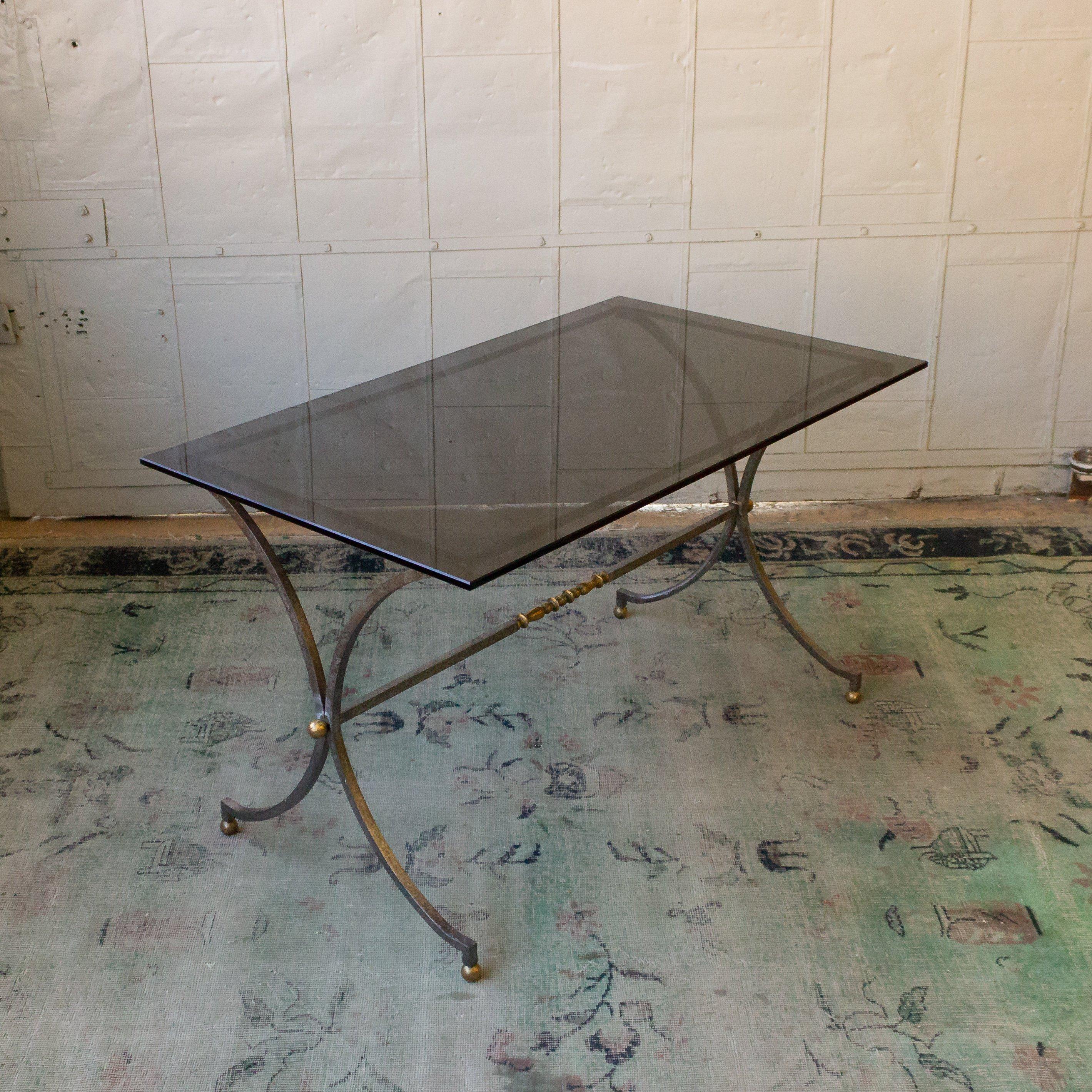 An exceptional Italian 1950s brushed steel end table. This elegant Italian brushed steel end table with brass details is a stunning piece of furniture that will elevate any living space. Circa 1950s, this table stands out with its new grey glass