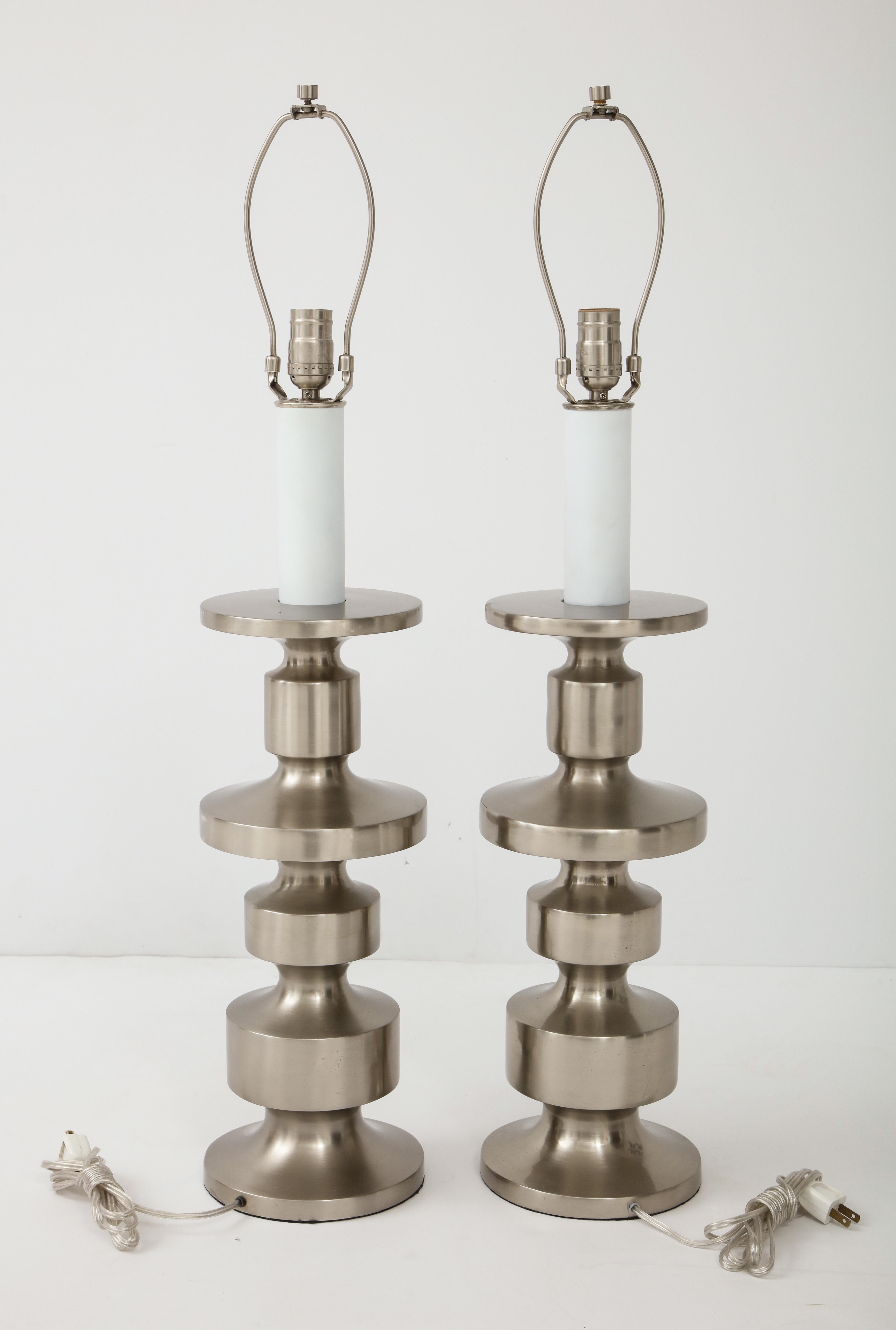 Pair of midcentury brushed steel TOTEM form lamps. Lamps have been rewired for use in the USA.