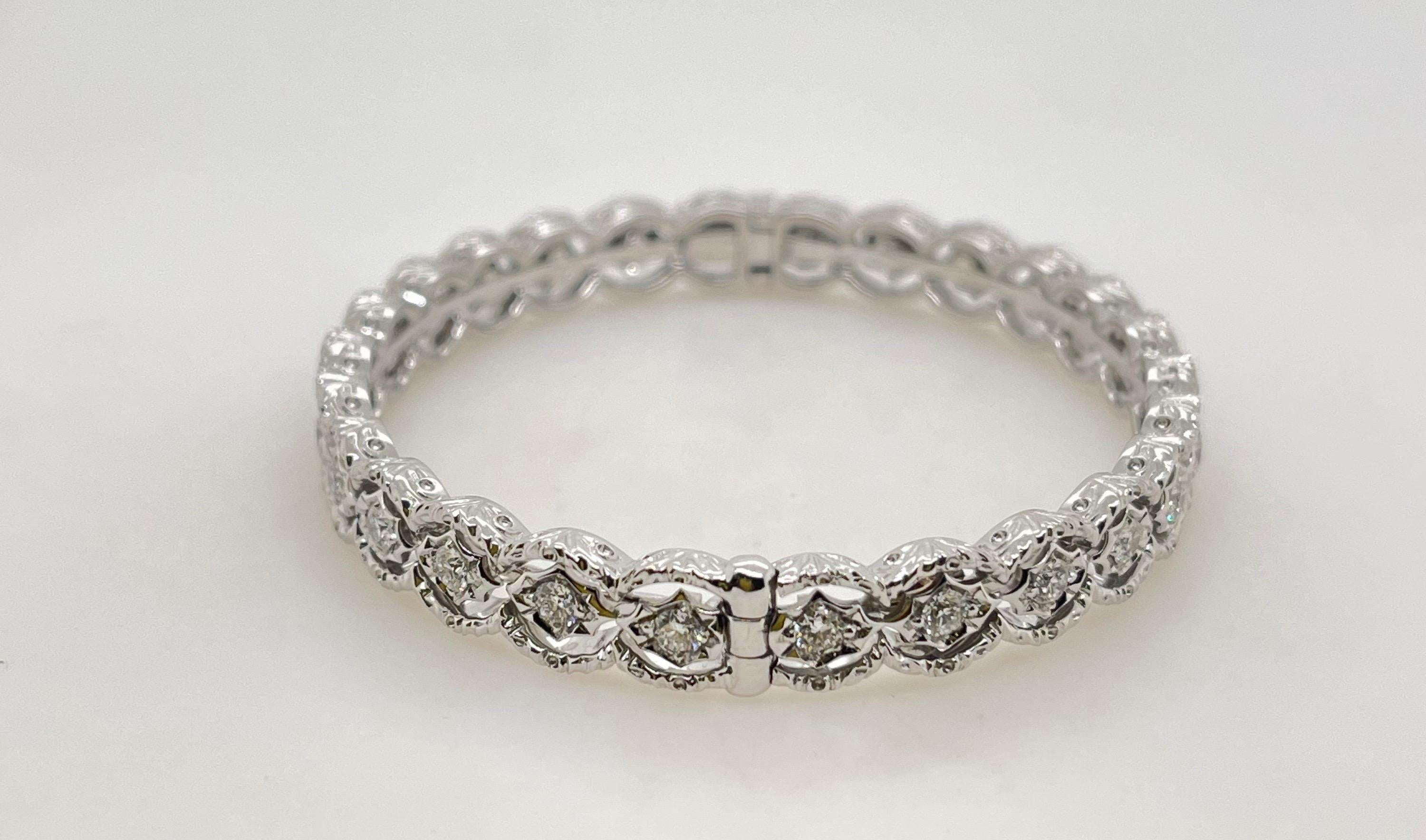 Brushed White Gold Round Diamond Hinged Bangle
18kt white gold 
24 round brilliant diamonds= 1.90ct 
