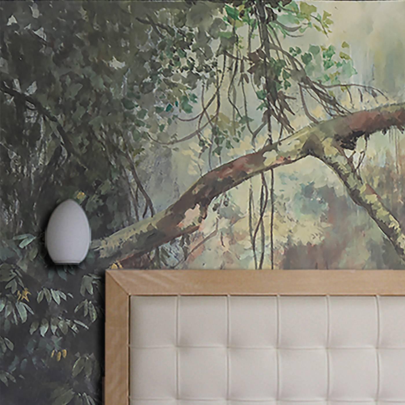 This superb wallpaper was painted freehand on paper by a skilled artisan who depicted a luxurious woods through which the light filters from above, adding an ethereal effect. The tones can be customized and a protective transparent finish can be