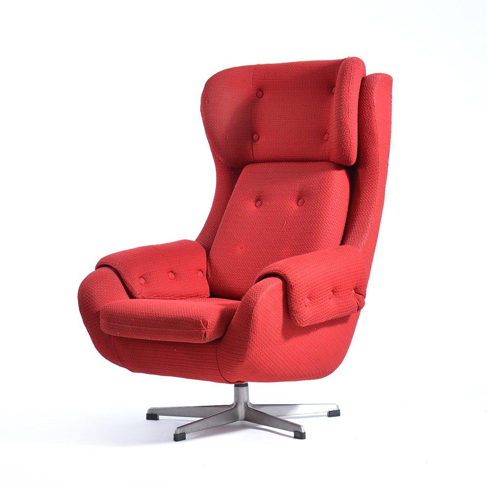 Great red chair swivel wing chair produced in Czechoslovakia in 1960s in the so-called Brussels era. Named after the famous Expo show in Brussels where Czechoslovakia won the Gold Medal for design. This chair is very comfortable, made of light