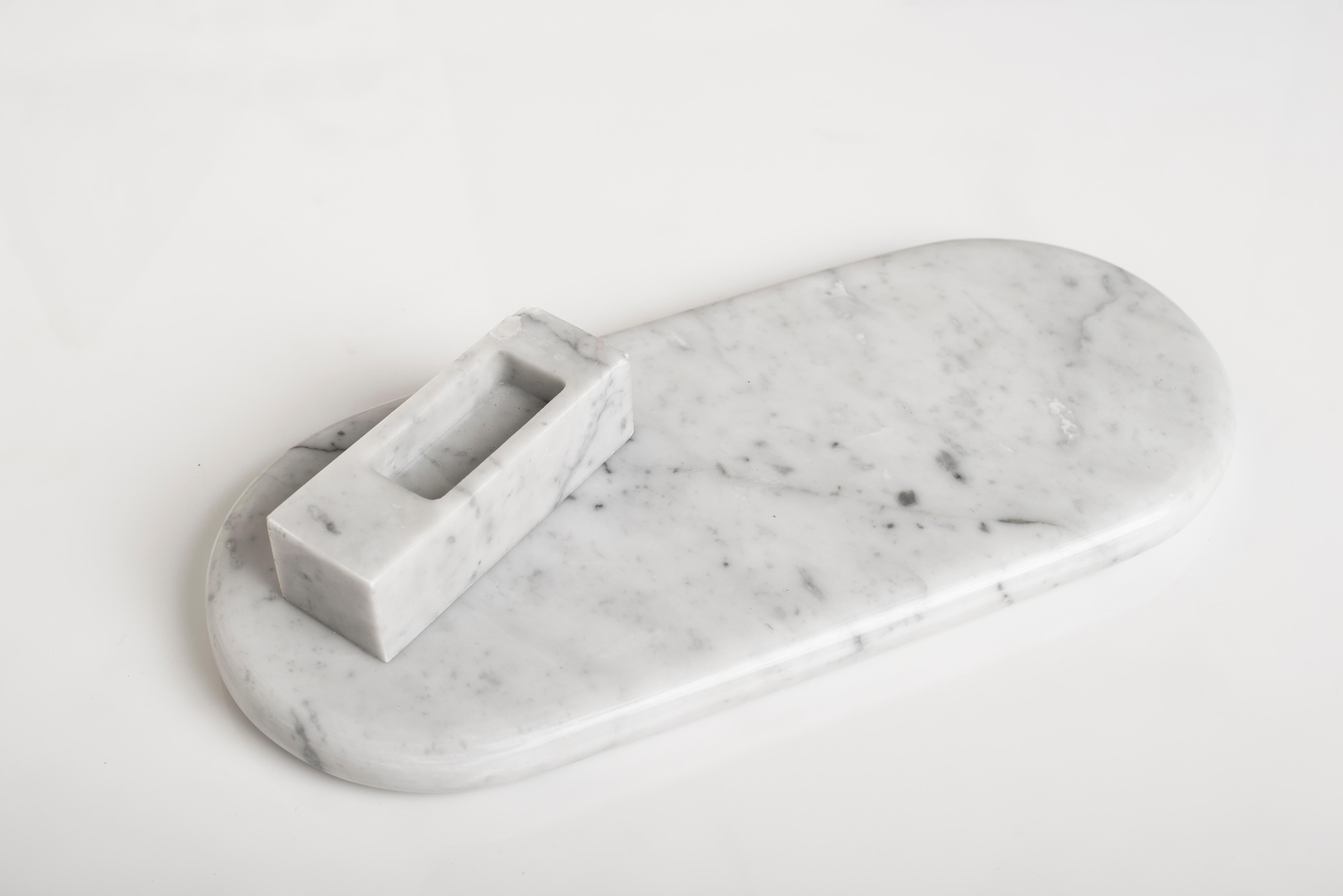 Brussels sculpture by Carlo Massoud
Handmade 
Dimensions: D 18 x W 45 x H 7 cm 
Materials: Carrara Marble

Carlo Massoud’s work stems from his relentless questioning of social, political, cultural, and environmental norms. He often pushes his