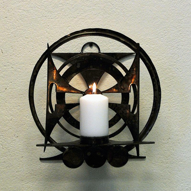 Beautiful Scandinavian patinated metal candle light holder for walls made in the manner of Henrik Horst. This acid cut metal sculpture has lovely ornament details of circles and triangles in which makes the brutalist shape and impression. Nice