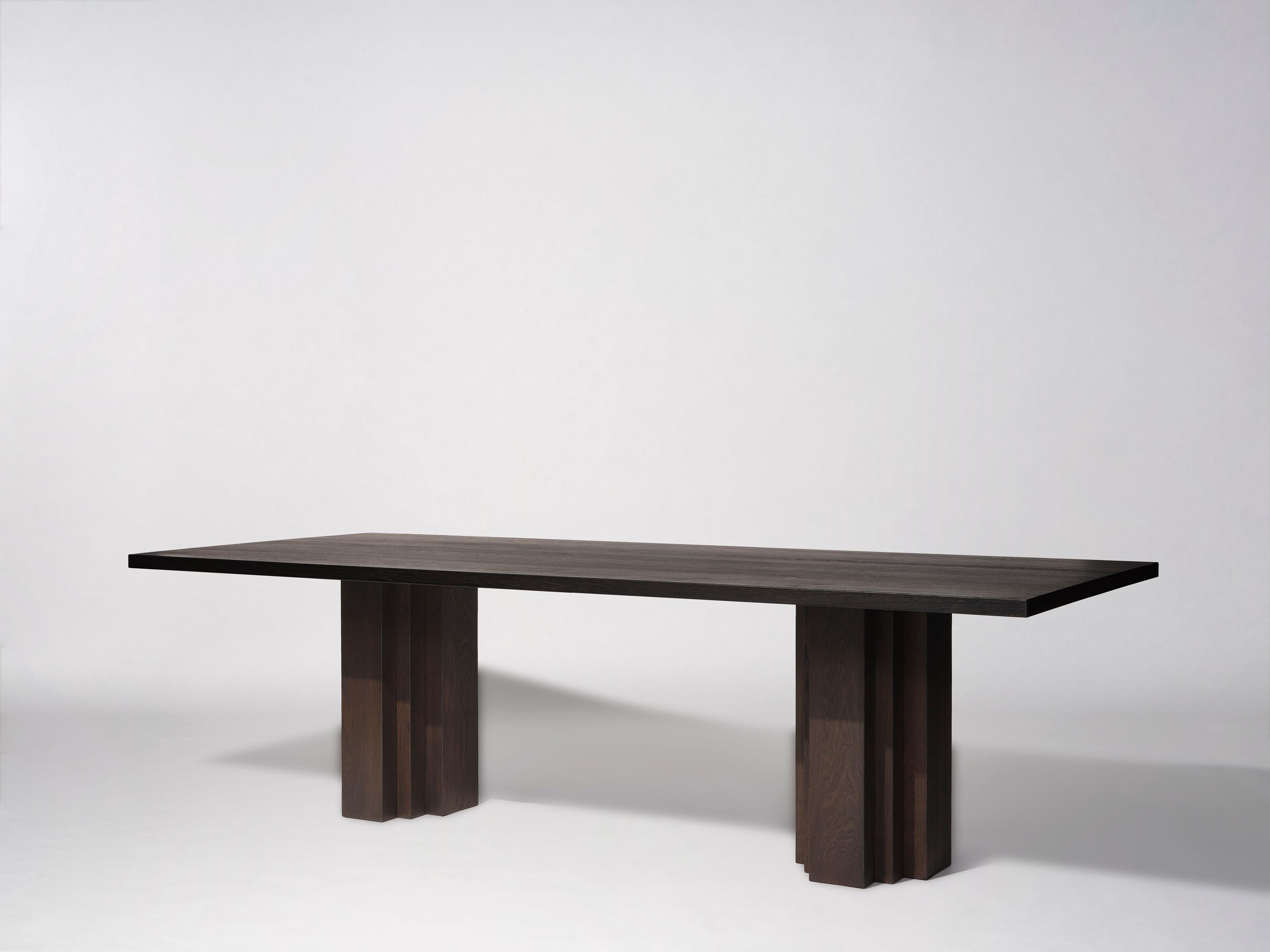 The Brut table takes cues from Brutalism and Amsterdam School architecture. A balance of raw materiality and subdued forms with geometrically expressive detailing.

Designed by Aad Bos and crafted in the Netherlands out of solid European oak or