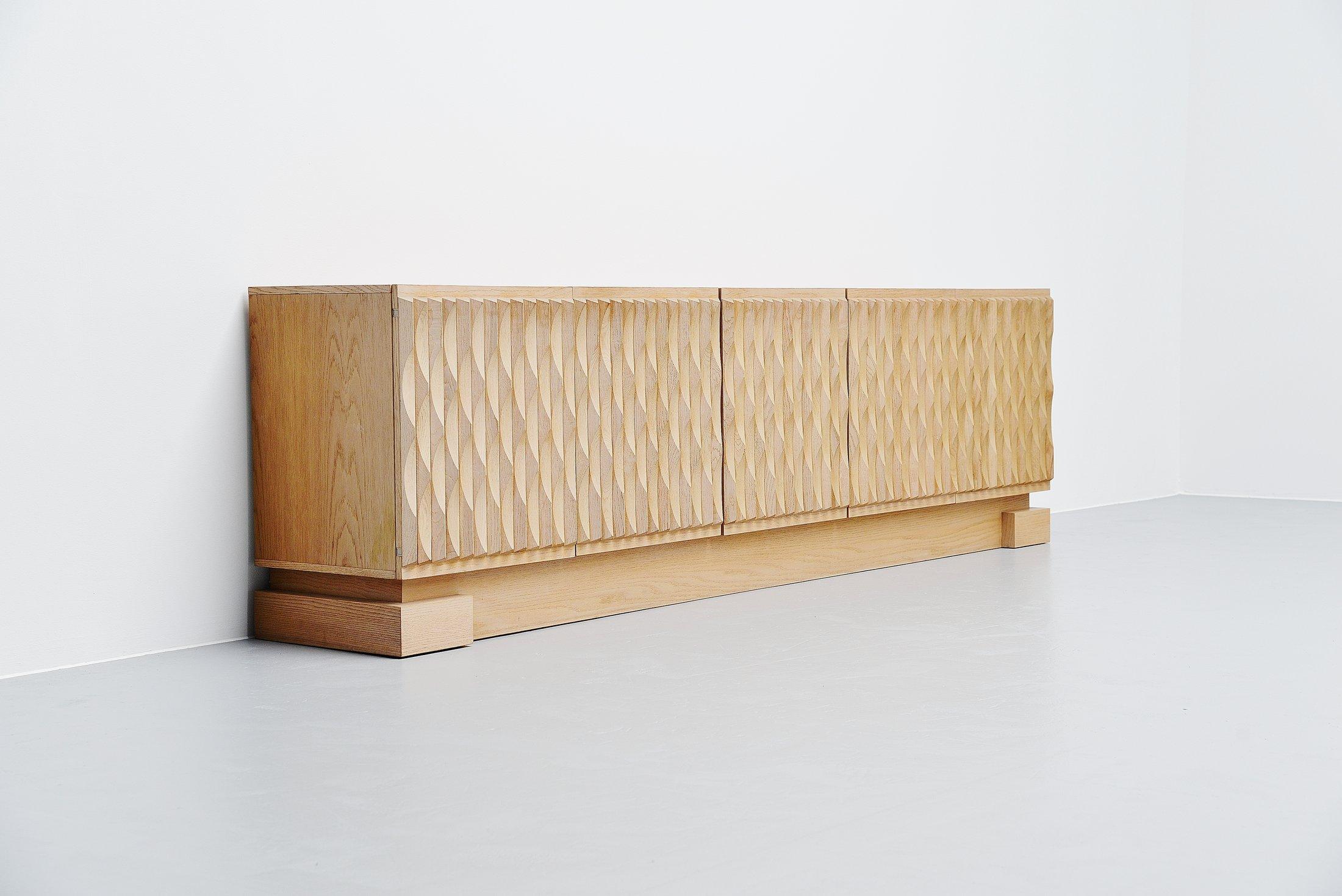 Beautiful Brutalist shaped sideboard/credenza made in Belgium 1970. In the 1970s some Belgian factories and little cabinet makers produced these Brutalist shaped cabinets and sideboards. Most of them with graphical designed doors in different shapes