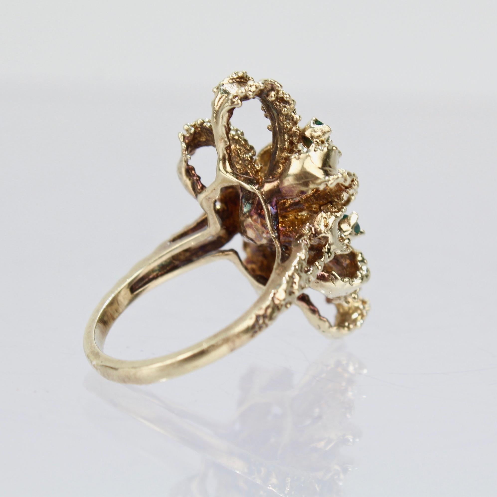 Brutalist 14 Karat Gold Emerald and Diamond Bow Form Cocktail Ring In Good Condition For Sale In Philadelphia, PA