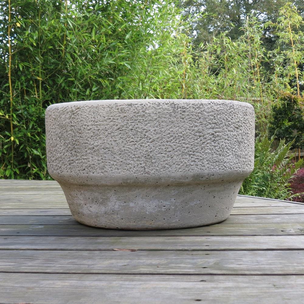 Solid concrete planter in the Brutalist style. Solid concrete with chiseled concrete decoration to the outside of the planter. It dates from the 1970s. Stamped to the inside of pot 