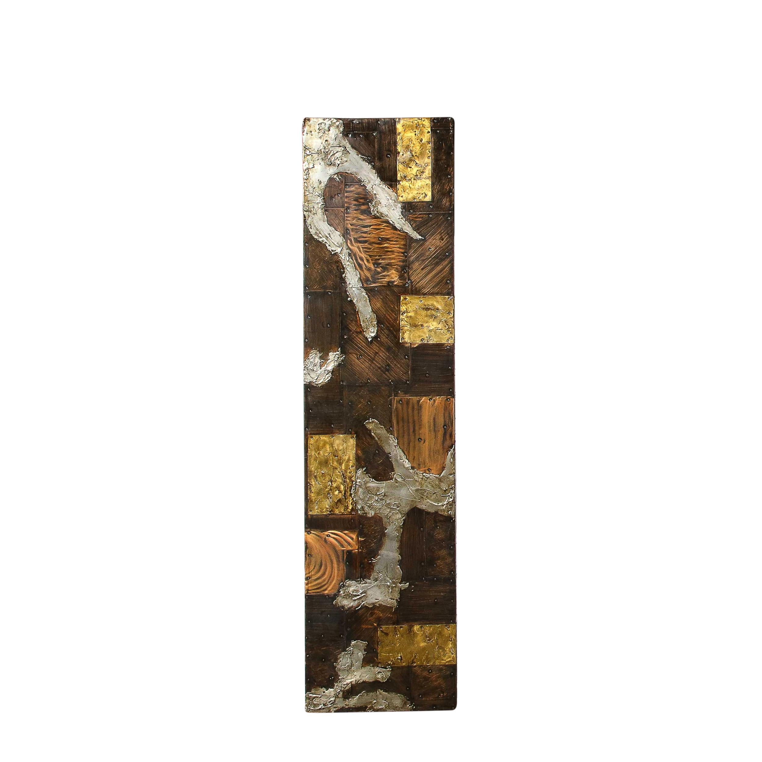 This sophisticated and important wall mounted sculpture was realized by the legendary 20th century American designer Paul Evans in 1973. This piece features the metal patchwork for which he is most renowned, and is an especially strong example of