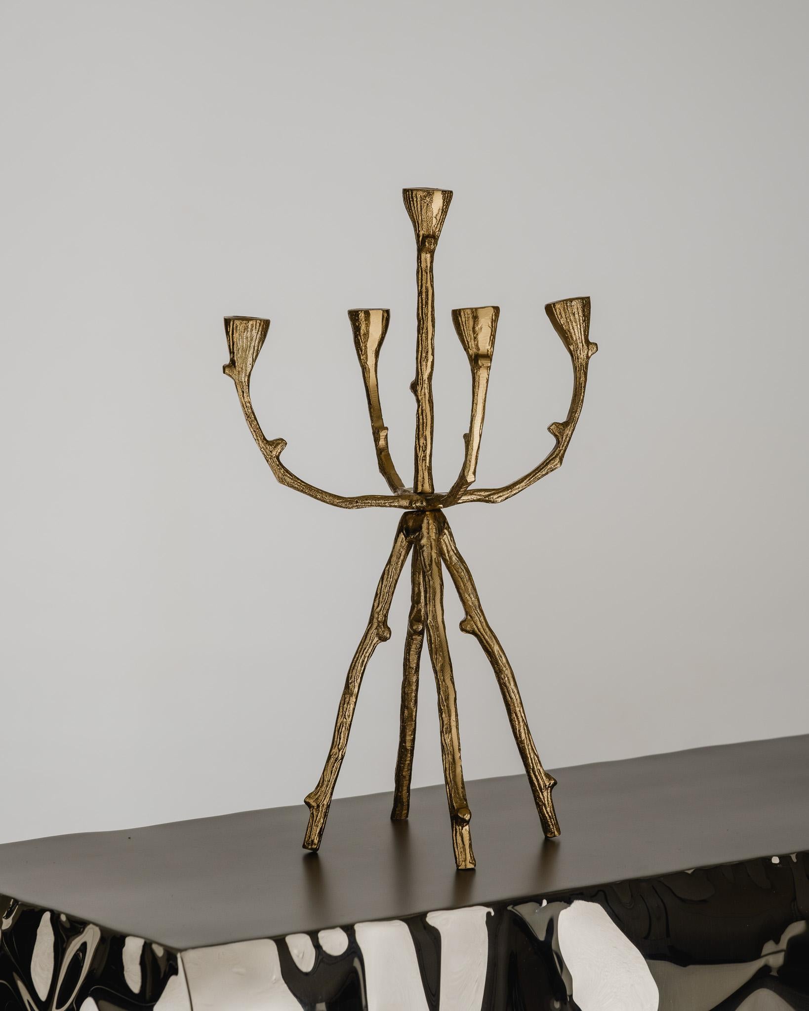 Gilded Metal Chandelier with Five Arms, featuring an organic branch-inspired design. A handcrafted piece typical of the Brutalist movement, celebrating raw materials and textured irregularities. Warm golden patina, stable four-legged structure.