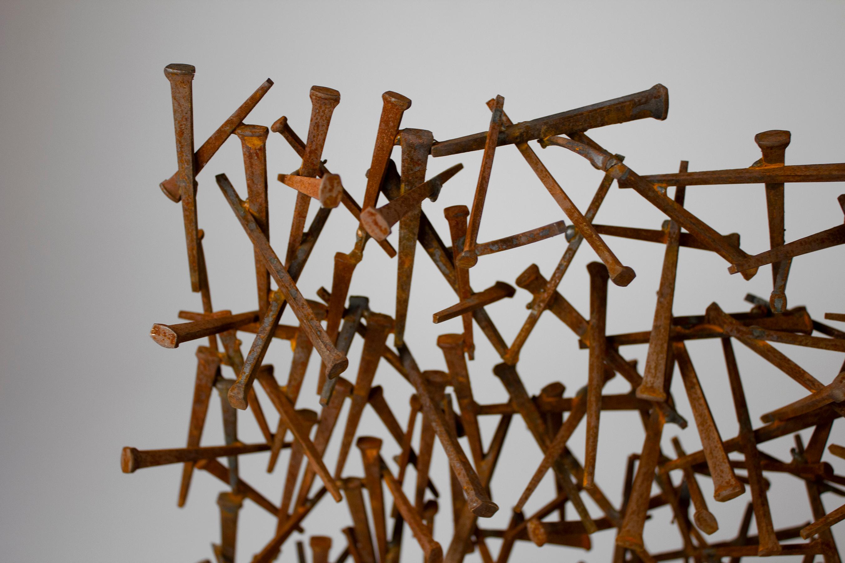 Brutalist Abstract Nail sculpture comprised of hundreds of hand welded flat nails with a rusticated patina. Would be great as a fireplace screen, in a window sil, or on a credenza.