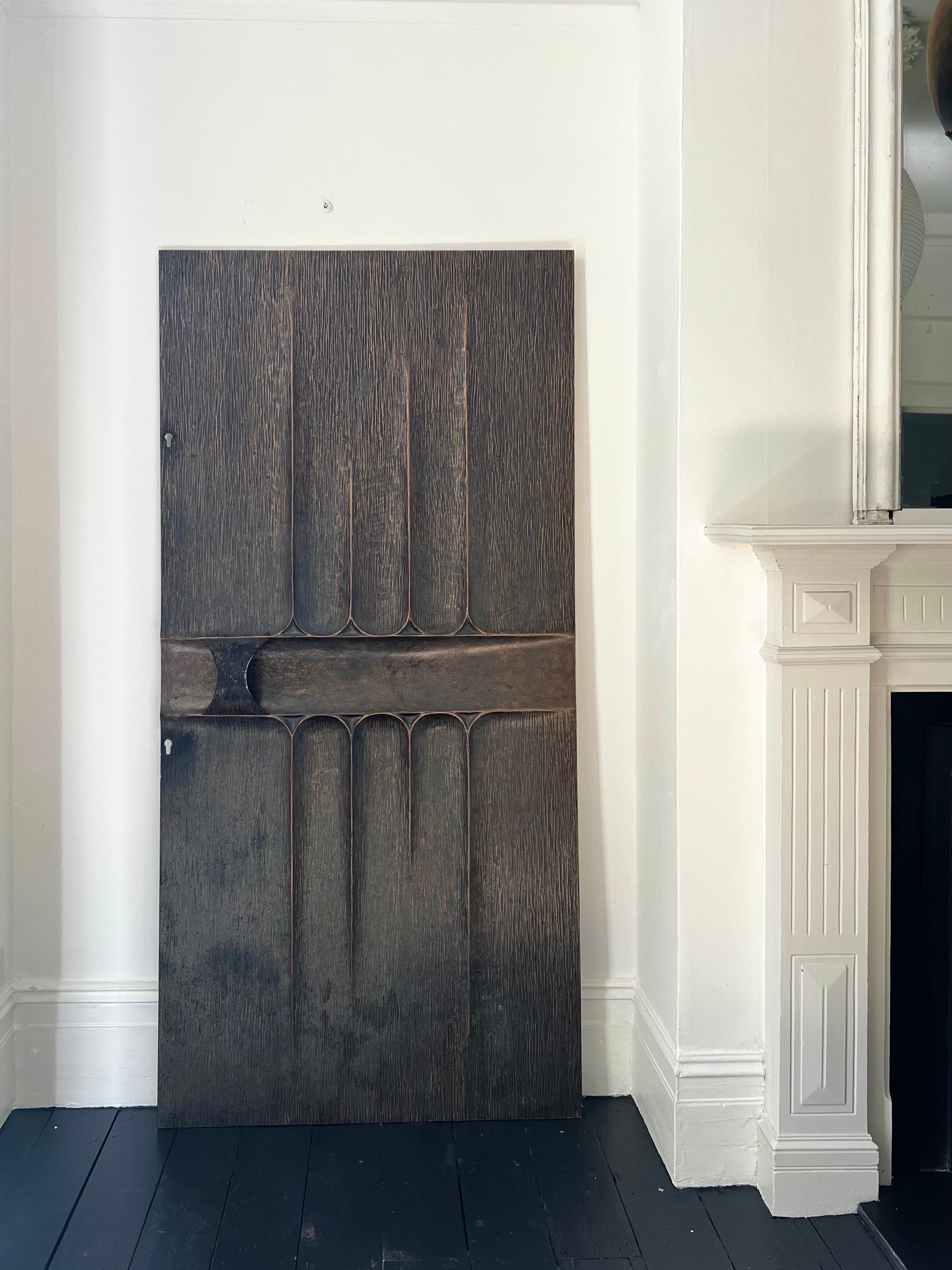 A Brutalist aluminium door panel with integrated handle and bronzed patina. Second half 20th century, found in Belgium.

A sculptural piece, unsigned, reminiscent of the style of Billy Joe McCarrol and David Gillespie for Forms + Surfaces. The panel