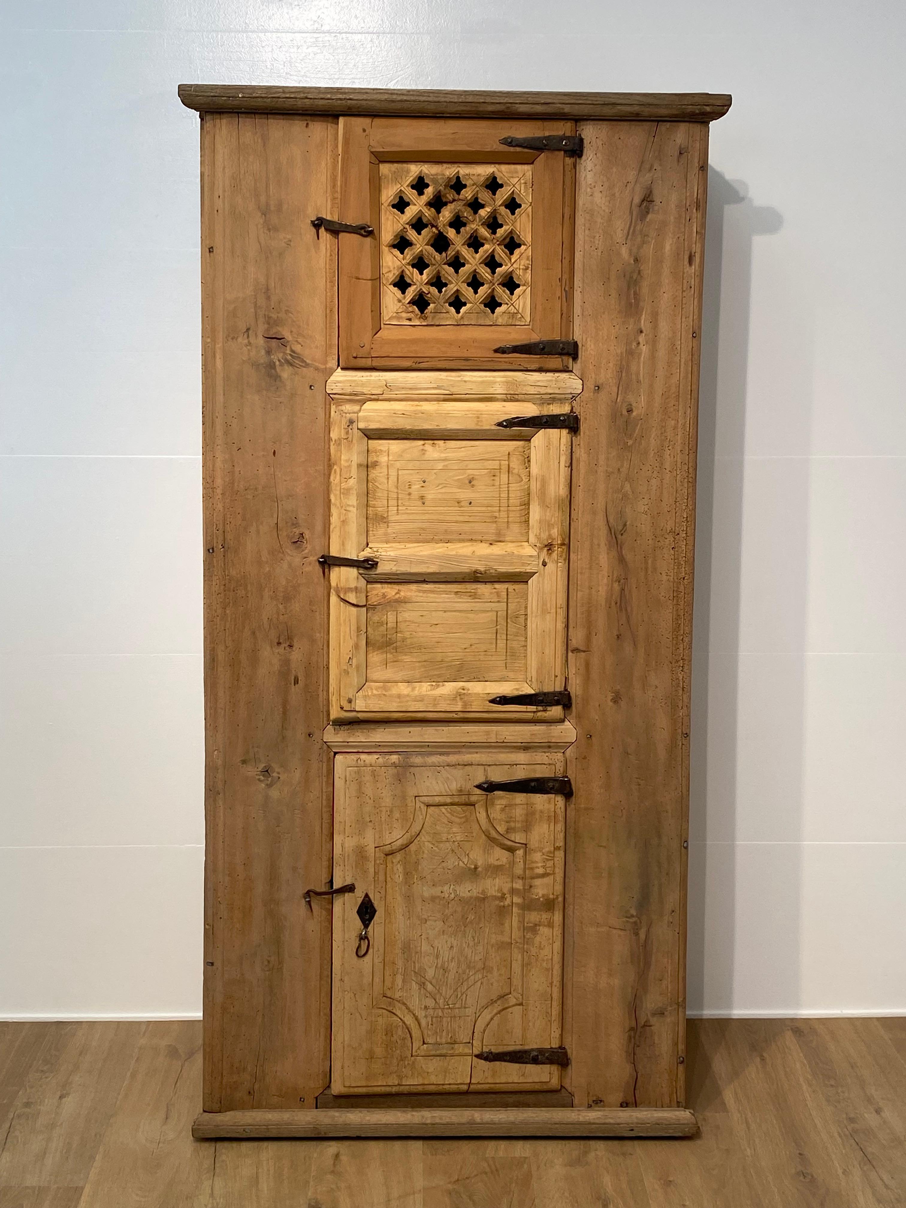 Exceptional, Brutalist Farmers Cupboard from the Catalan Region in the North Of Spain,from the 19 th Century,an Arte Povere artwork,
the cupboard is made of bleached Chestnut and other Fruitwoods,
and was used to store food and wine and bread, that