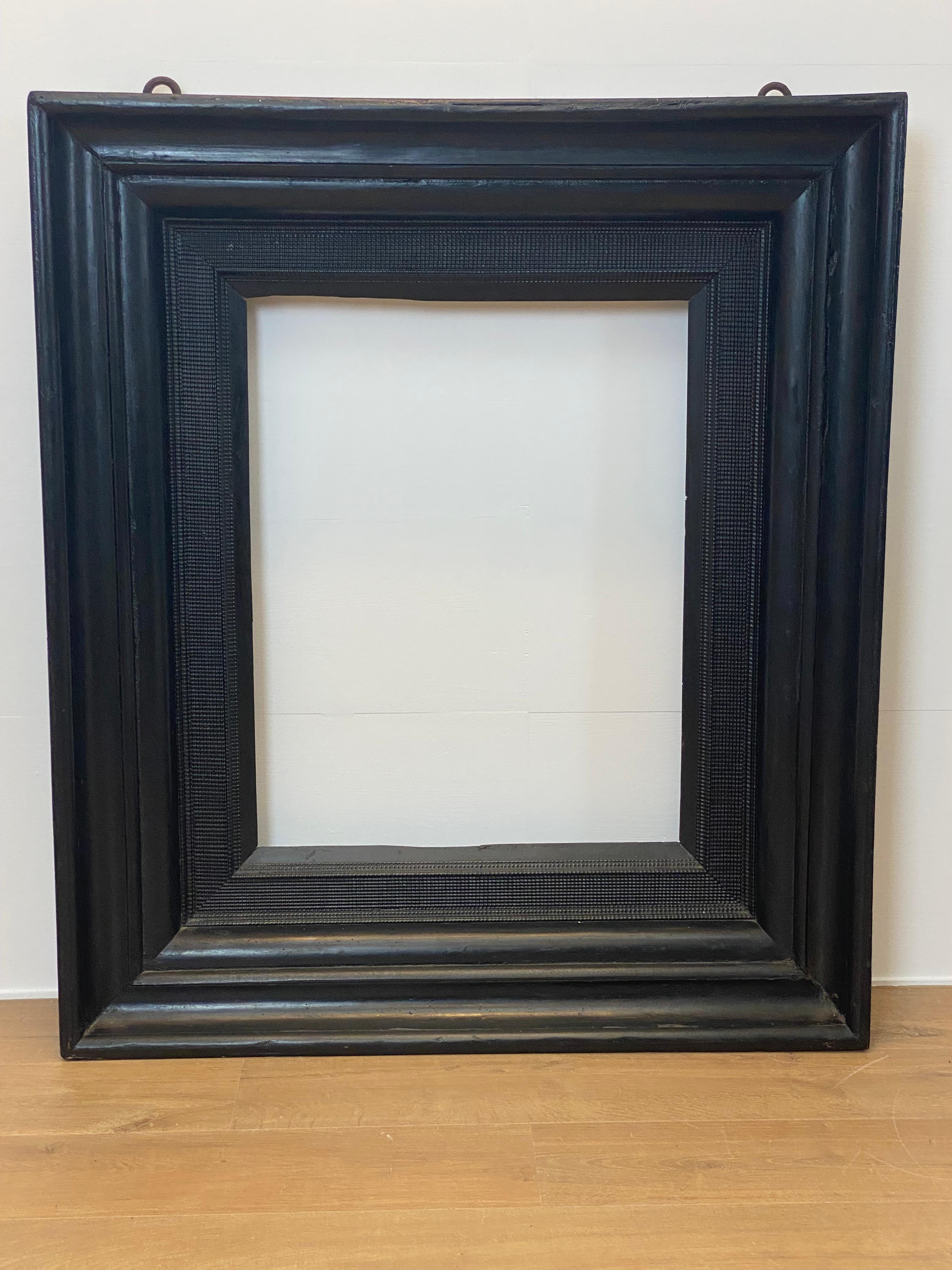Exceptional antique wooden frame from Italy, 17th century,
made in a black patinated Fruitwood,
simple design and simple decorations,
beautiful patina and wear of the wood,
can be used for different purposes,
very decorative piece.