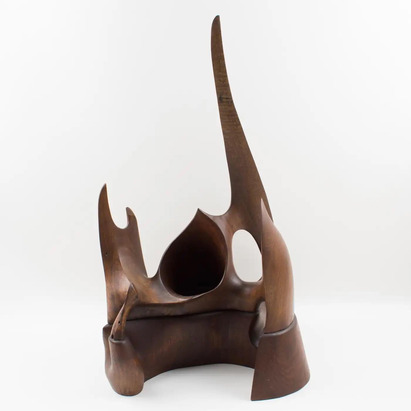 This brutalist architectural wood carving ornamental sculpture is entirely handmade and hand-carved and has an incredible futuristic flair with an elegant original patina. It is almost impossible to describe the shape, each side offers a different