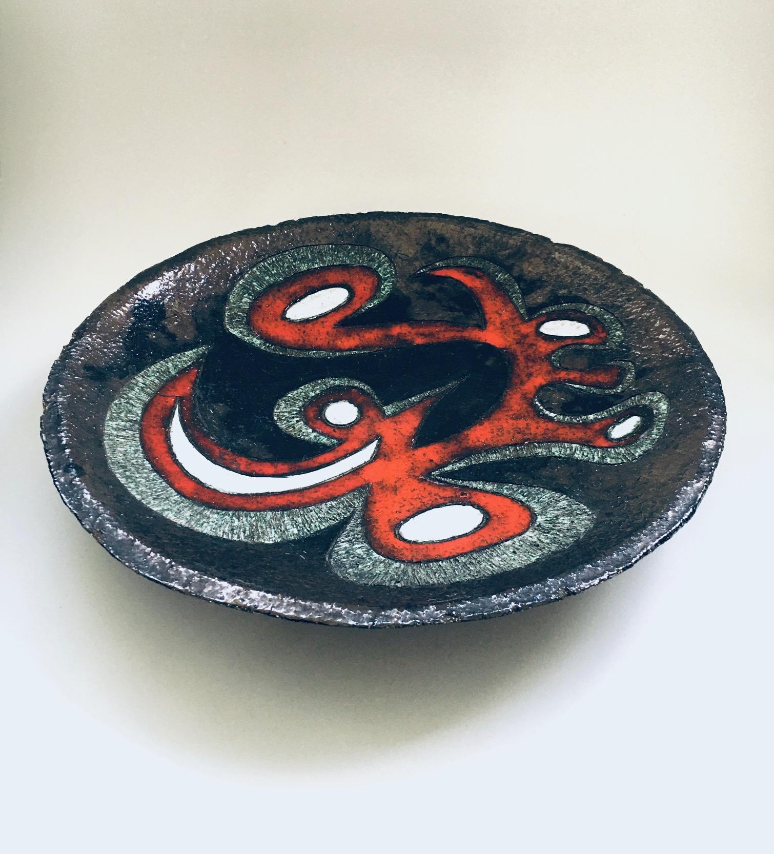 Vintage Brutalist Design Art Ceramics XL Bowl, signed Delabell. Made in Belgium, 1960's. Attributed to the Perignem / Amphora Art Pottery Studios. Black under glaze with red, greenish and white over glazes. Abstract figurative illustration in