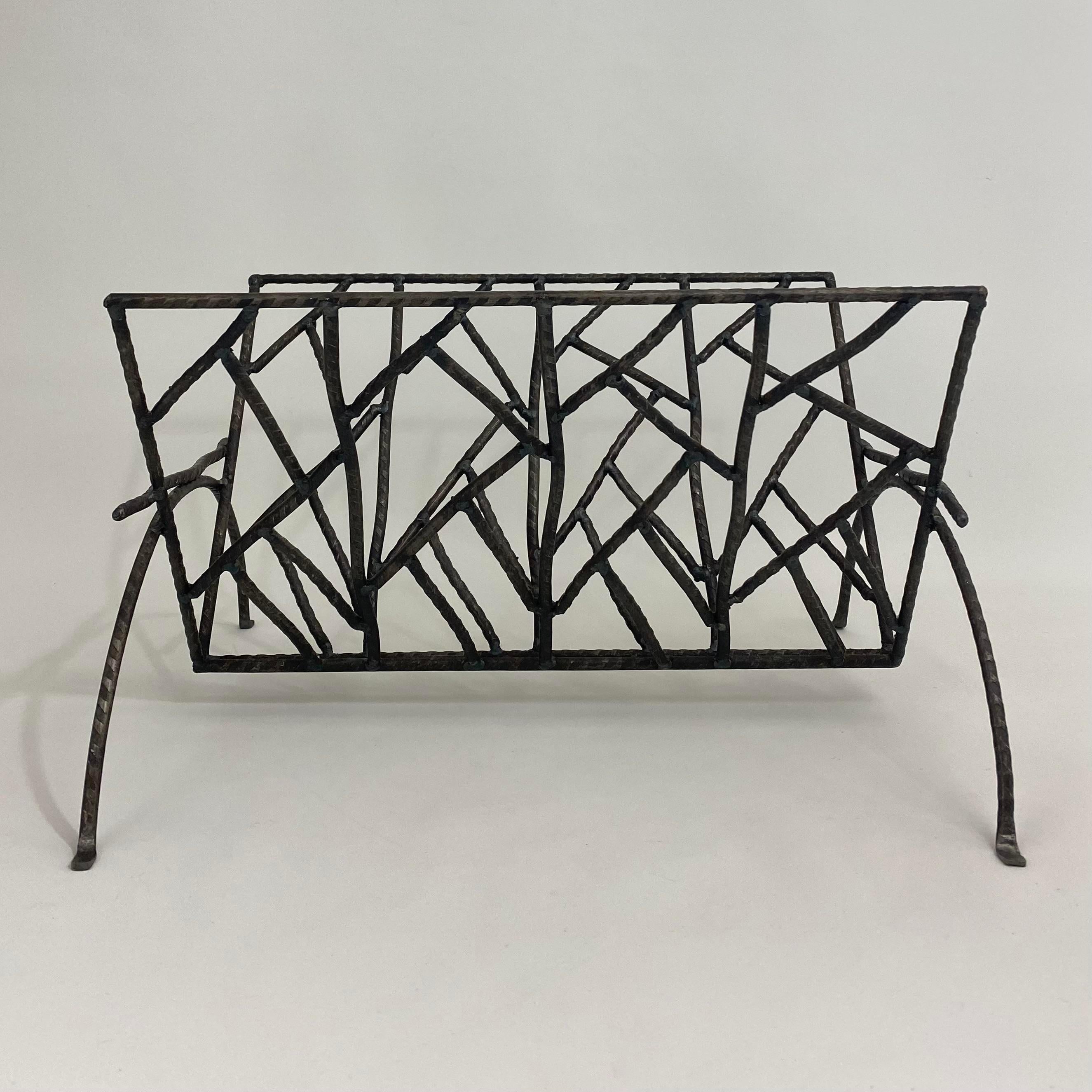 Circa 1980s artist studio brutalist magazine rack. Geometric welded iron pattern. One of a kind item. Can hold books or magazines.