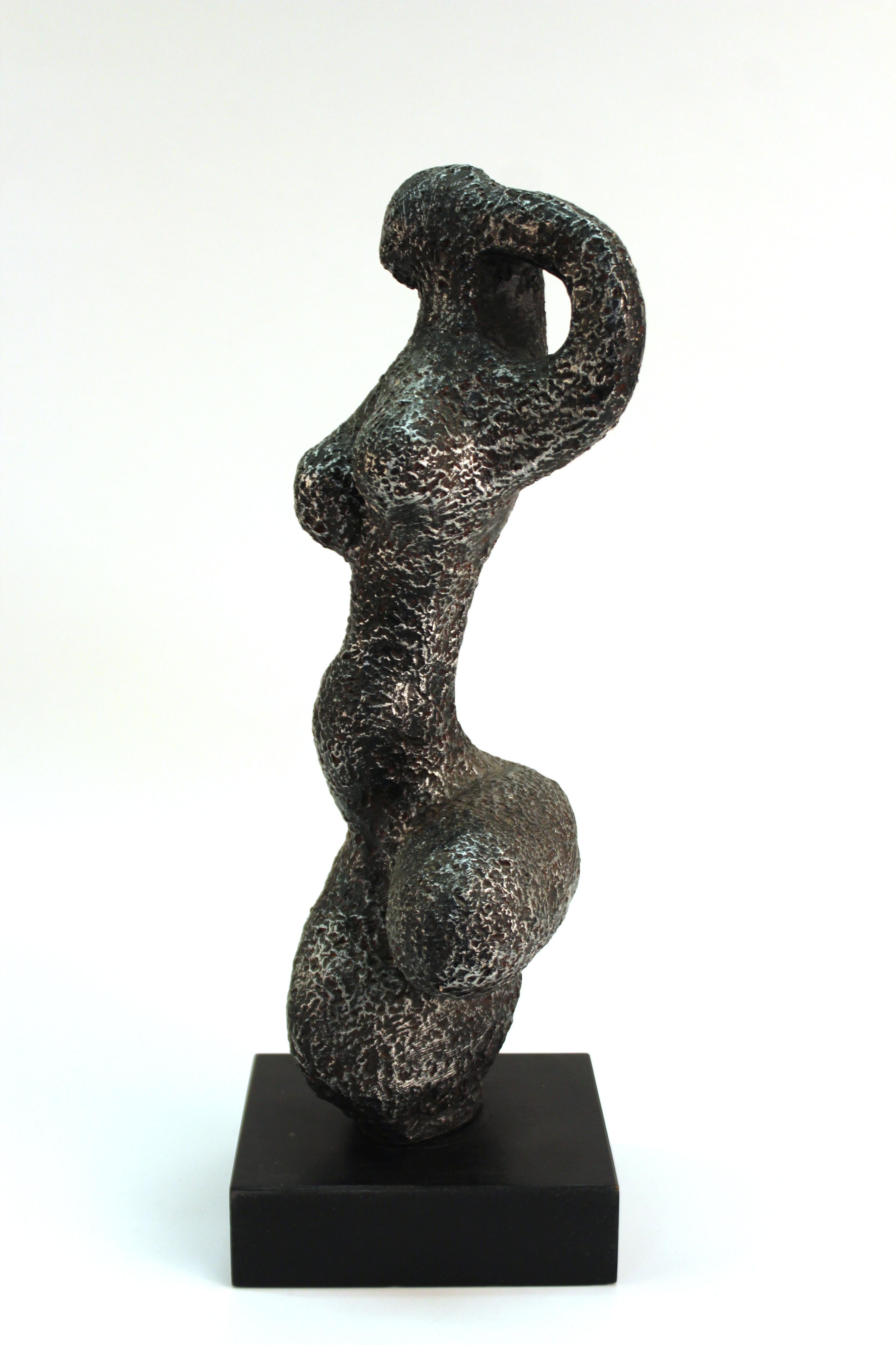 American Brutalist abstract female nude sculpture made by Austin Productions. The piece dates from the 1970s and is in great vintage condition with some minor age-appropriate wear to the base.