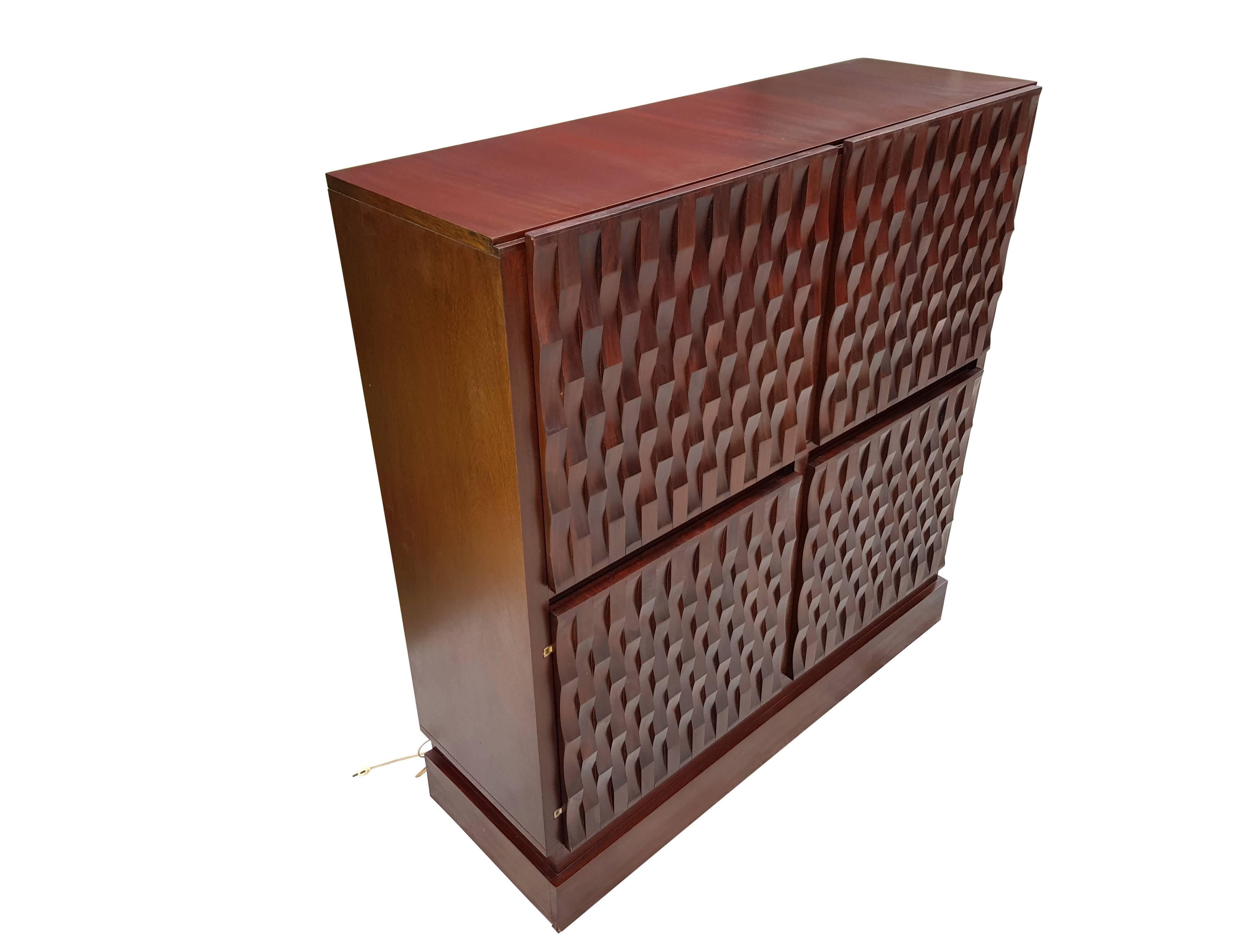 Very rare Mahogany bar cabinet from Musterring.
The bar has exceptionaly 3 dimensional grafphics, wich gaves a very modernistic touch on the doors.
The bar is labled with the maker.
This piece is very good matching with interiors like, Willy